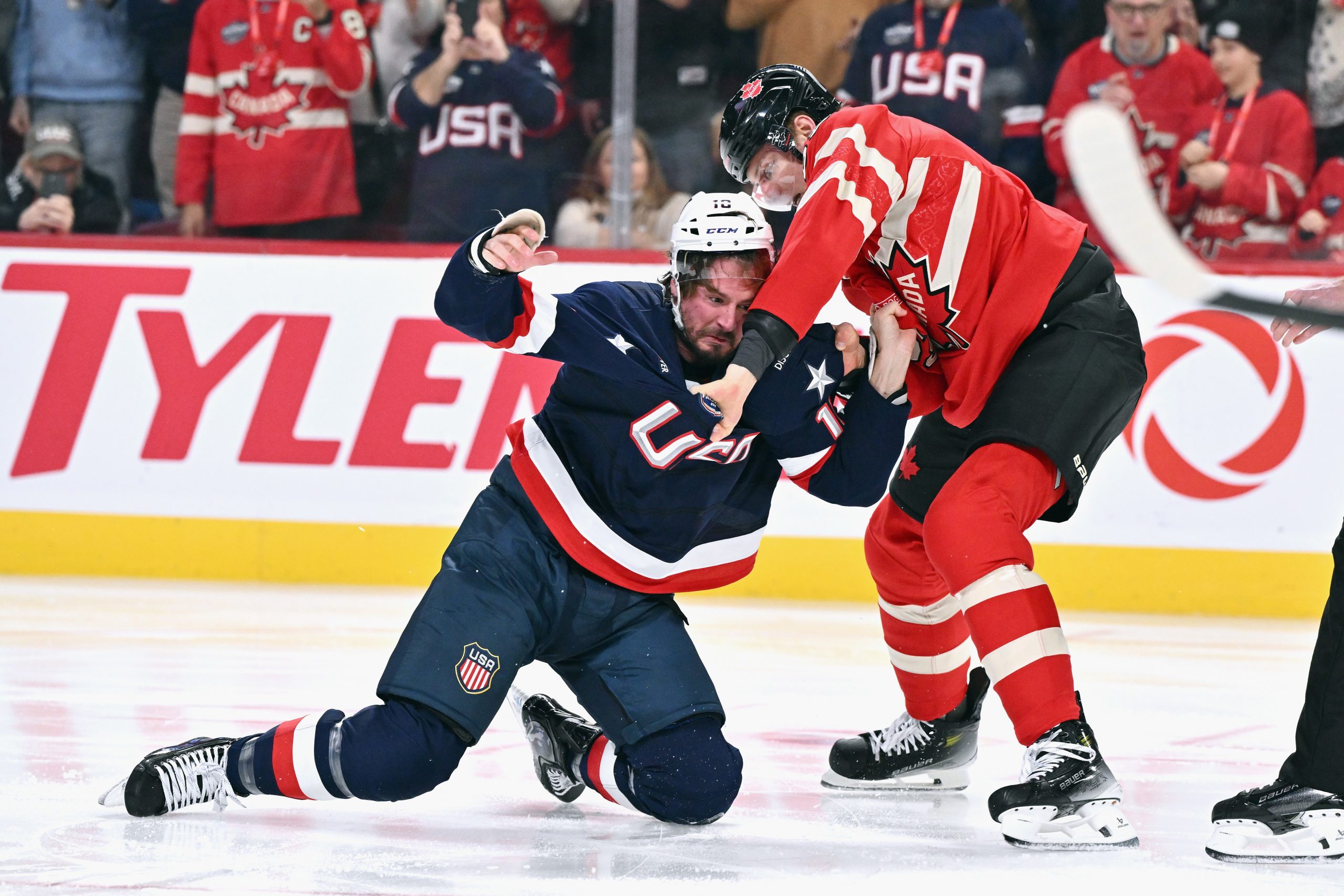 J.T. Miller #10 of Team USA and Colton Parayko #55 of Team Canada fight.