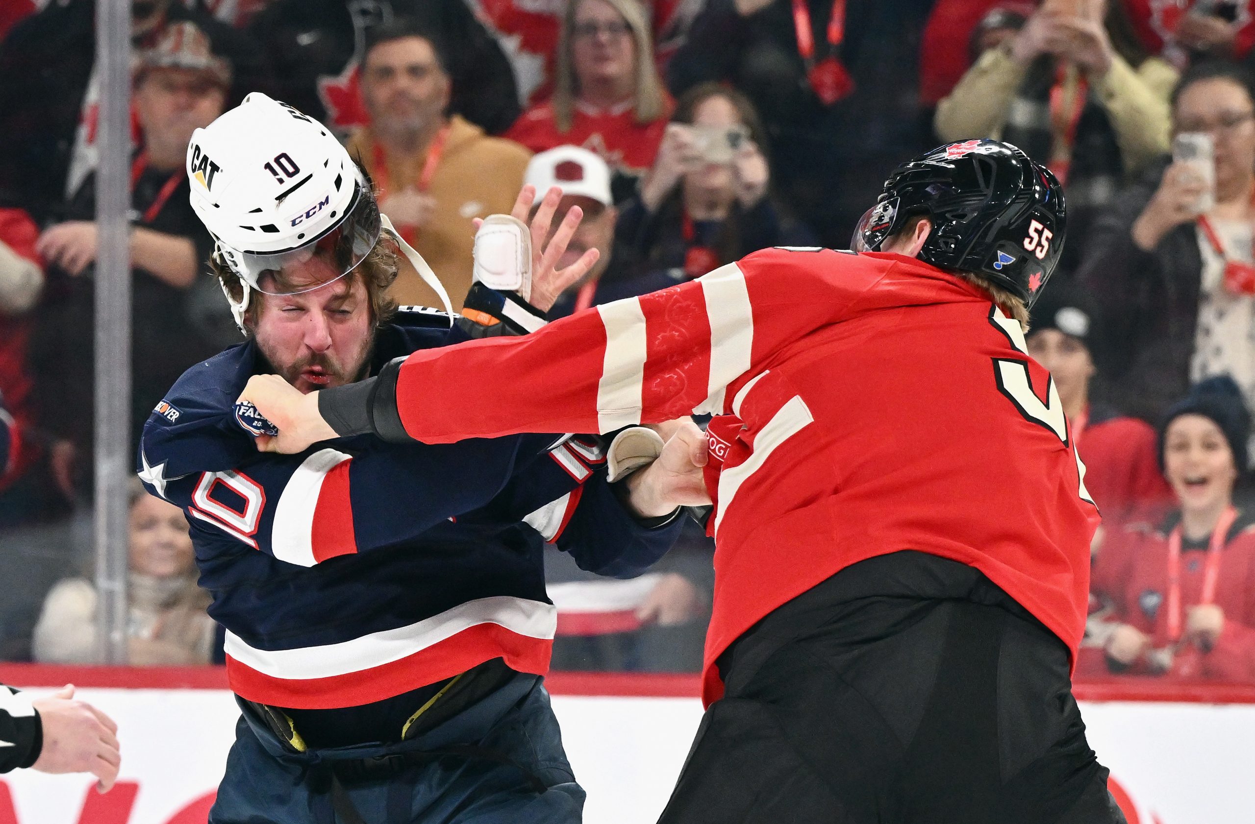 J.T. Miller #10 of Team USA and Colton Parayko #55 of Team Canada fight.