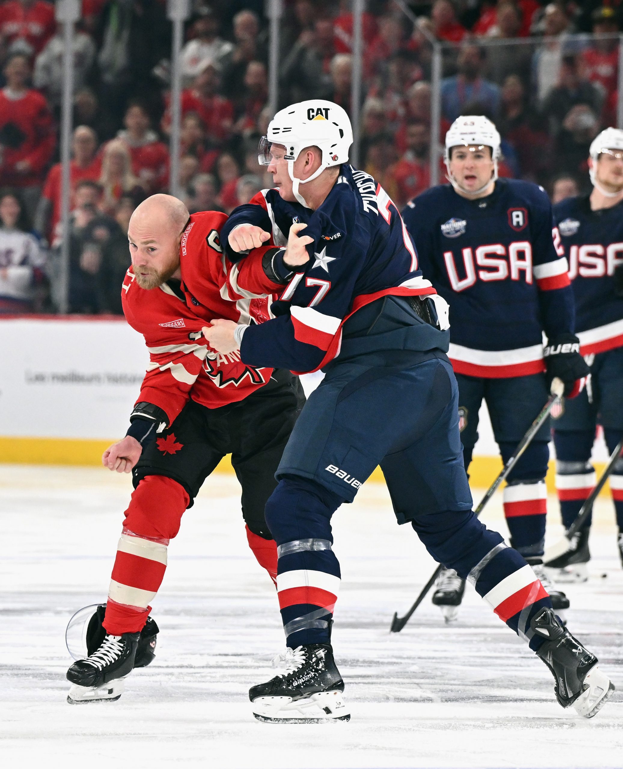 Brady Tkachuk #7 of Team USA and Sam Bennett #9 of Team Canada fight.