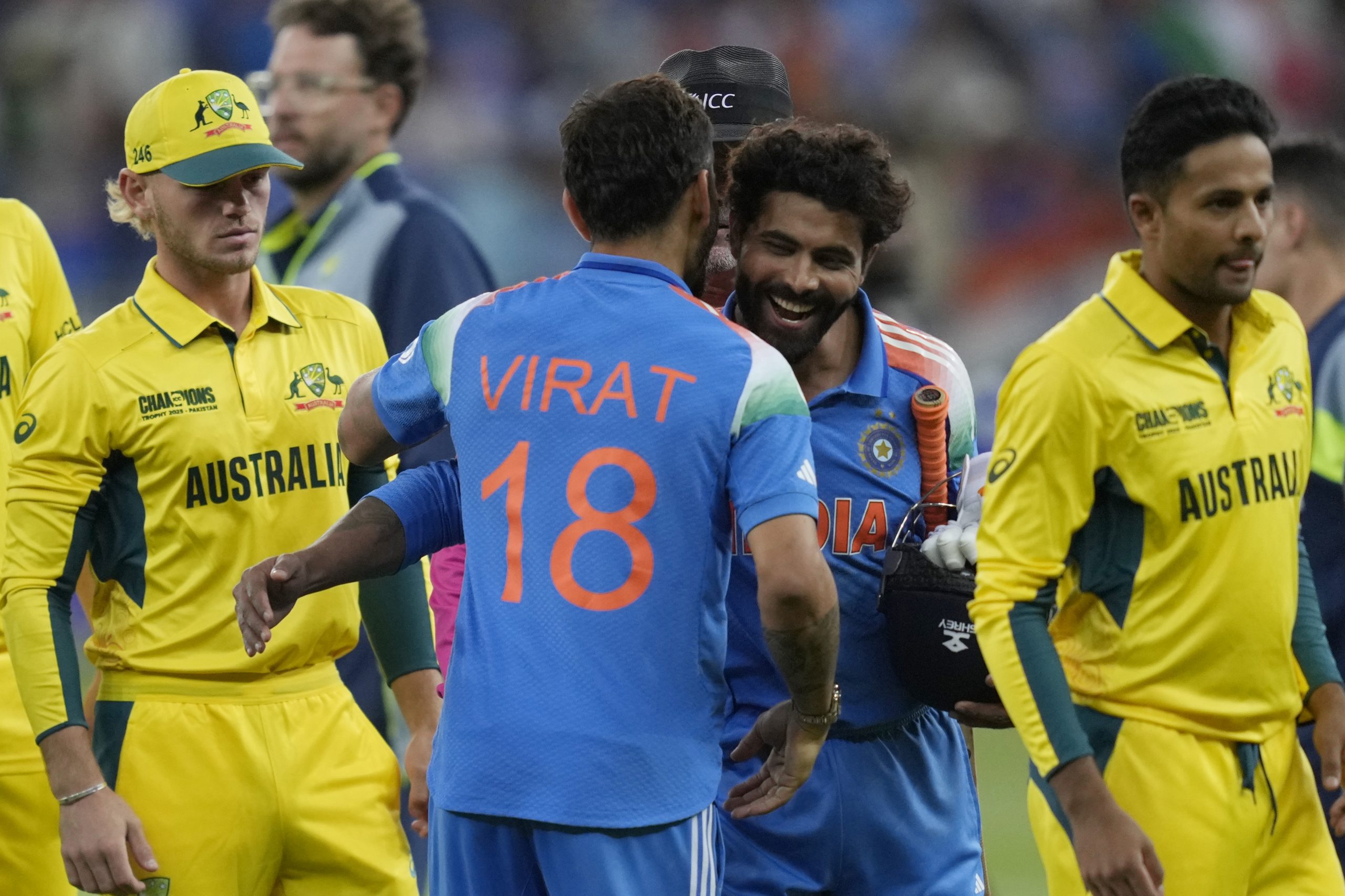 India's Virat Kohli hugs teammate Ravindra Jadeja.