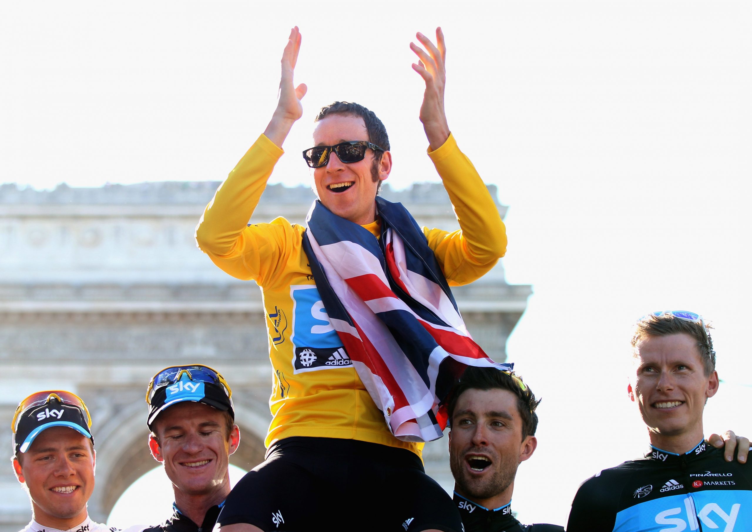 Bradley Wiggins and his team celebrate winning the 2012 Tour de France.