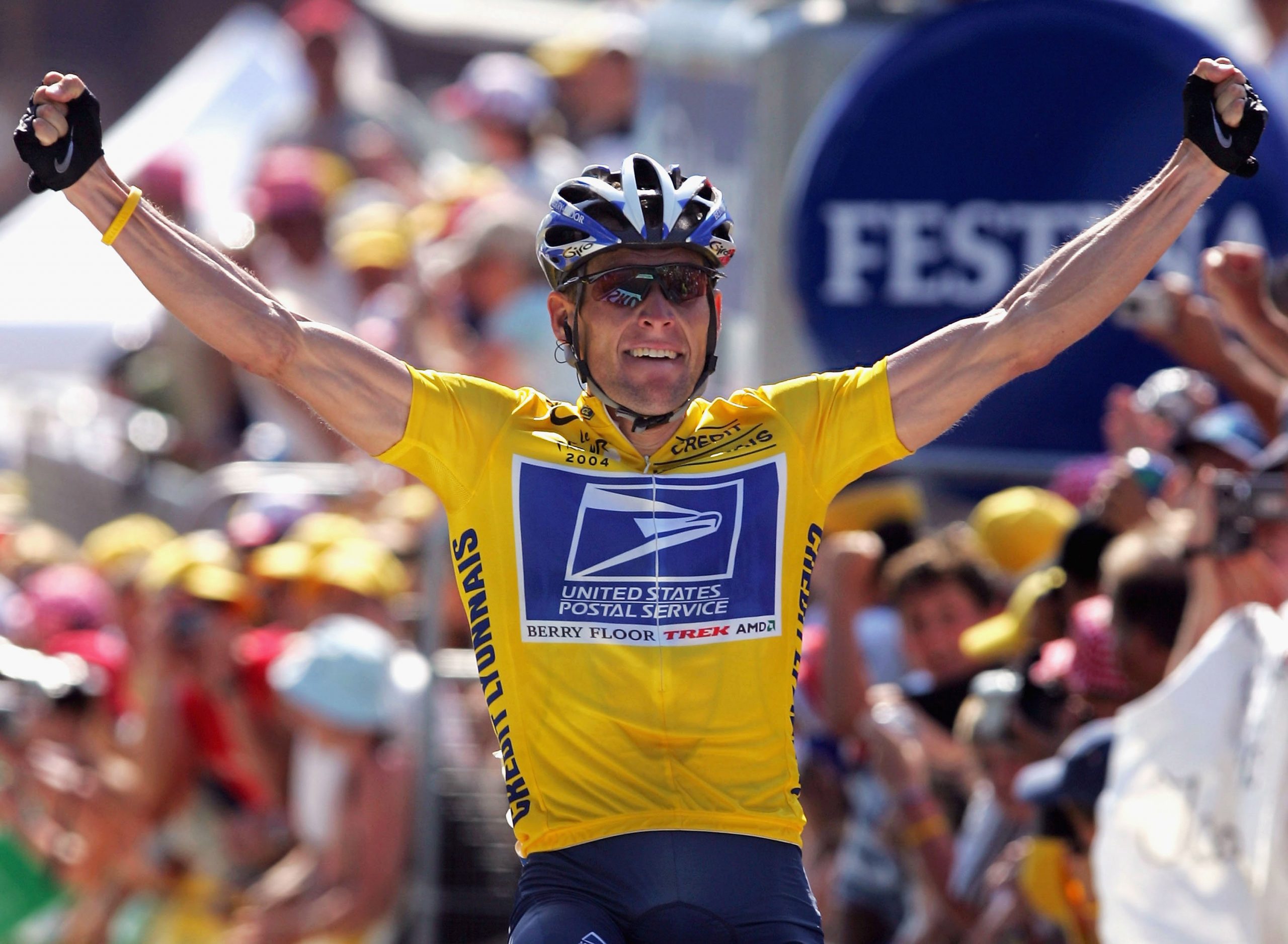 Lance Armstrong celebrates winning a stage in the 2004 Tour de France.