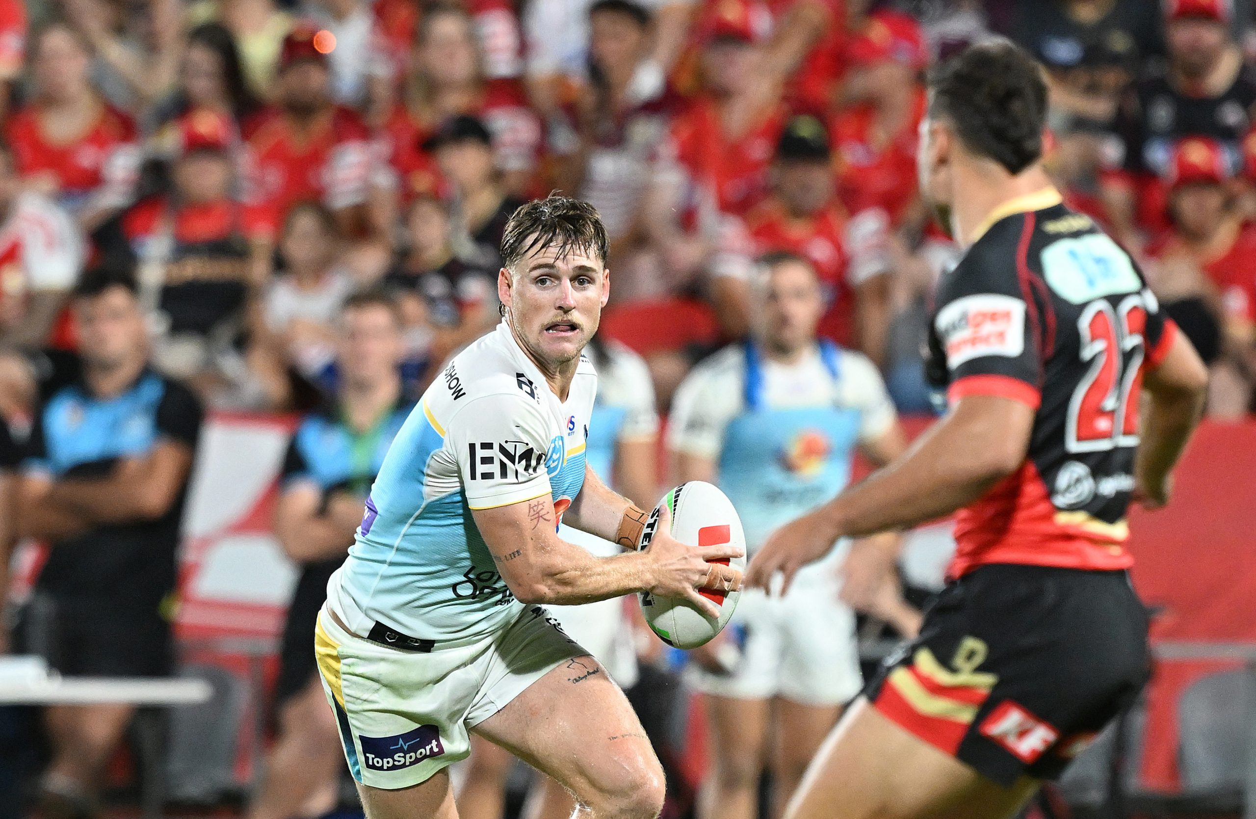 AJ Brimson of the Titans looks to pass.