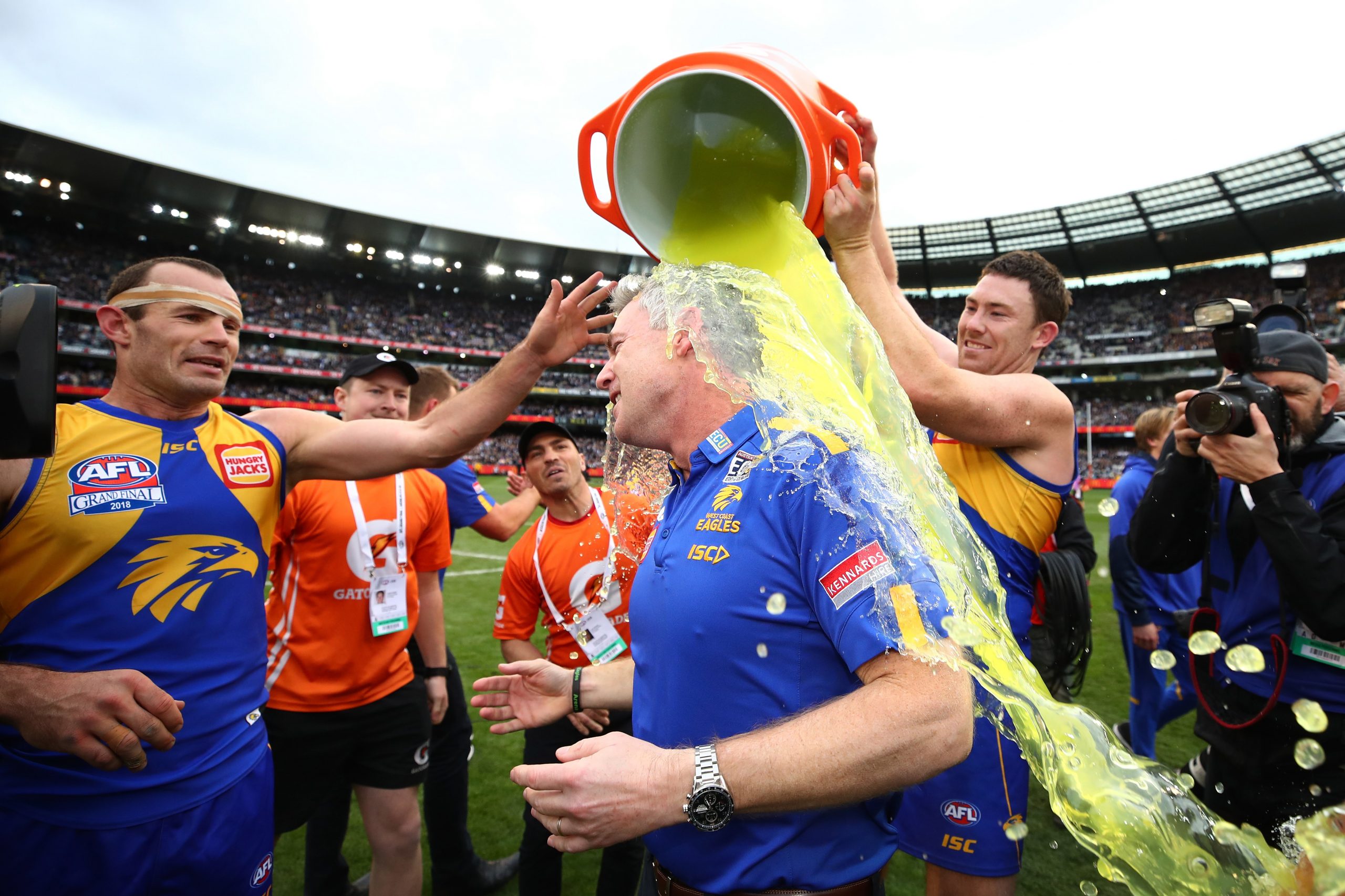 McGovern dumping Gatorade on coach Adam Simpson after the 2018 grand final.