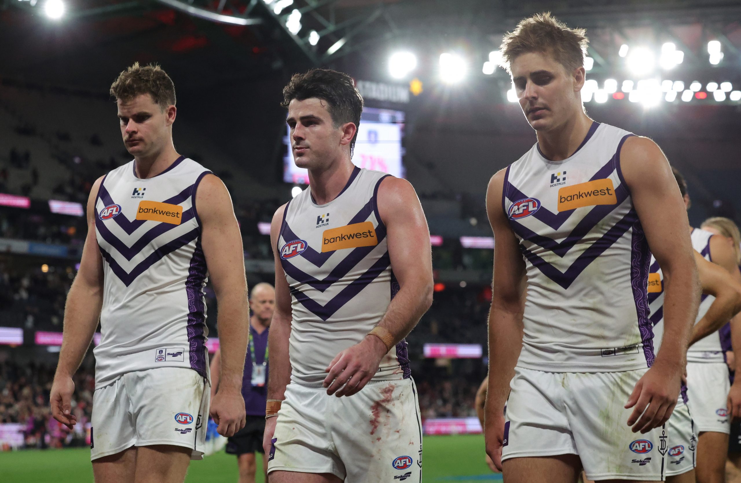 Freo players leave the field following the loss to St Kilda