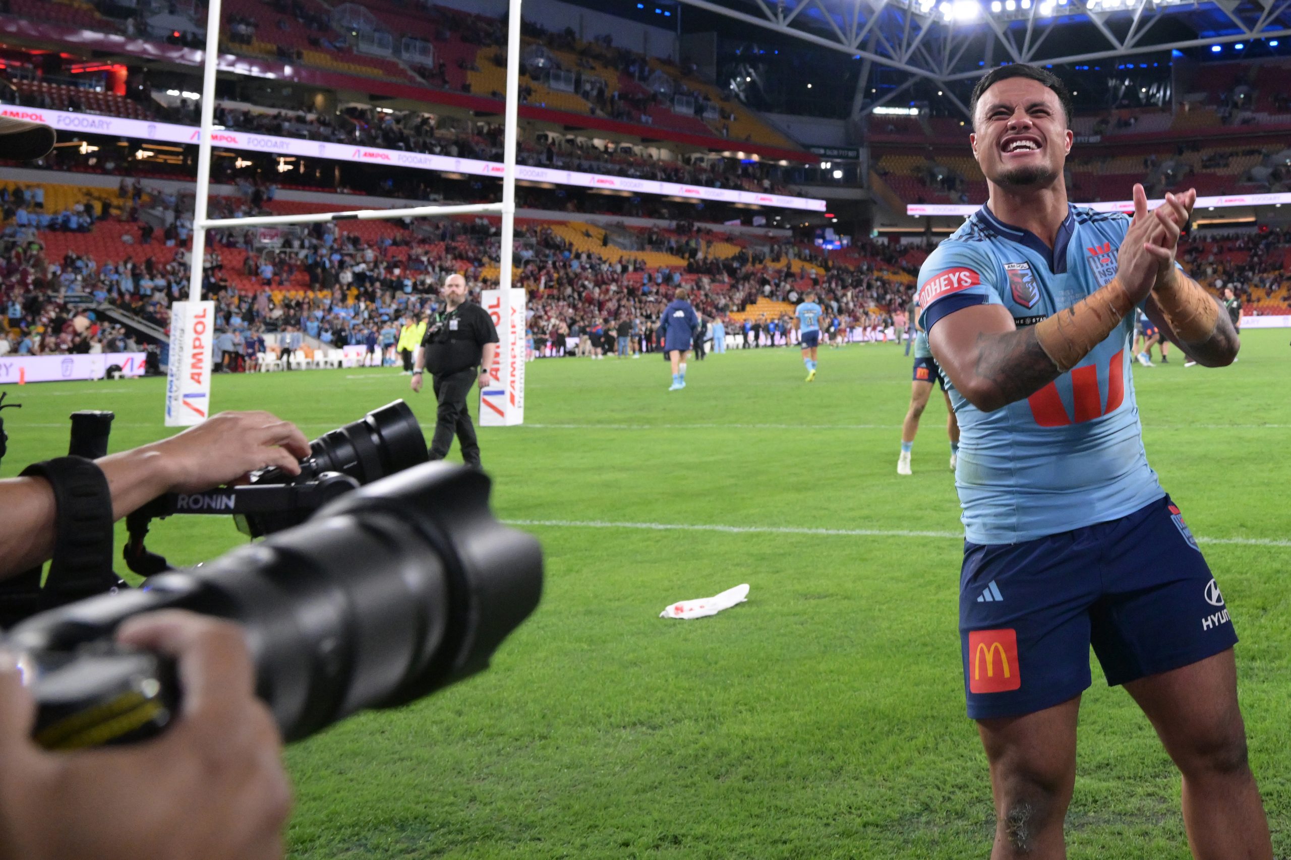 Spencer Leniu gives it to the Suncorp Stadium crowd.