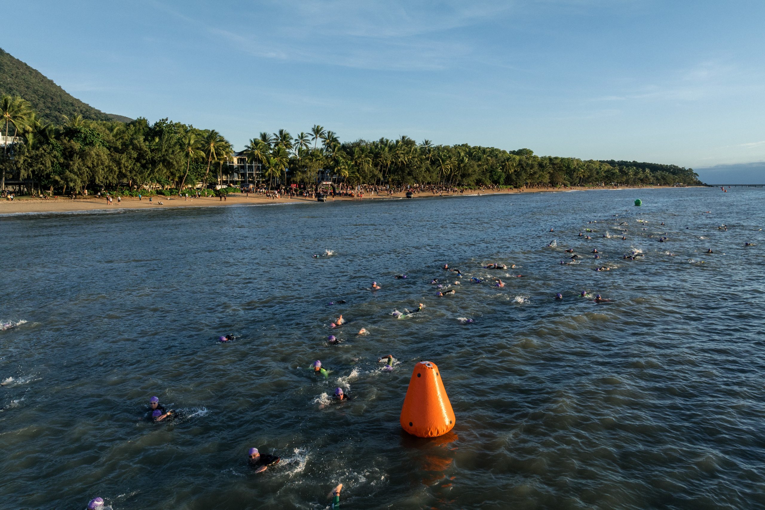 IRONMAN athletes complete the swim course at Palm Cove as part of IRONMAN Cairns.