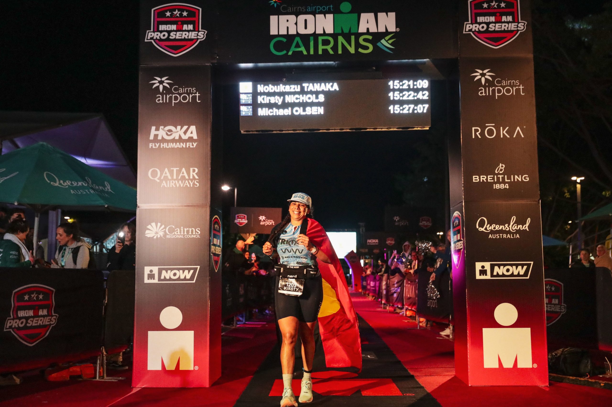 First Nations and TRIMOB athlete Kirsty Nichols crosses the finish line at IRONMAN Cairns.
