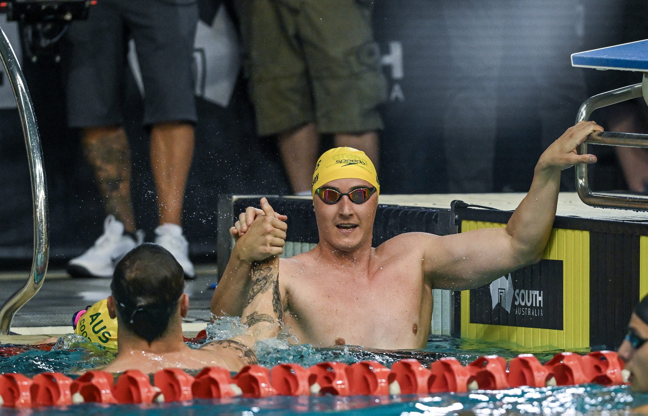 Cameron McEvoy and Kyle Chalmers embrace.