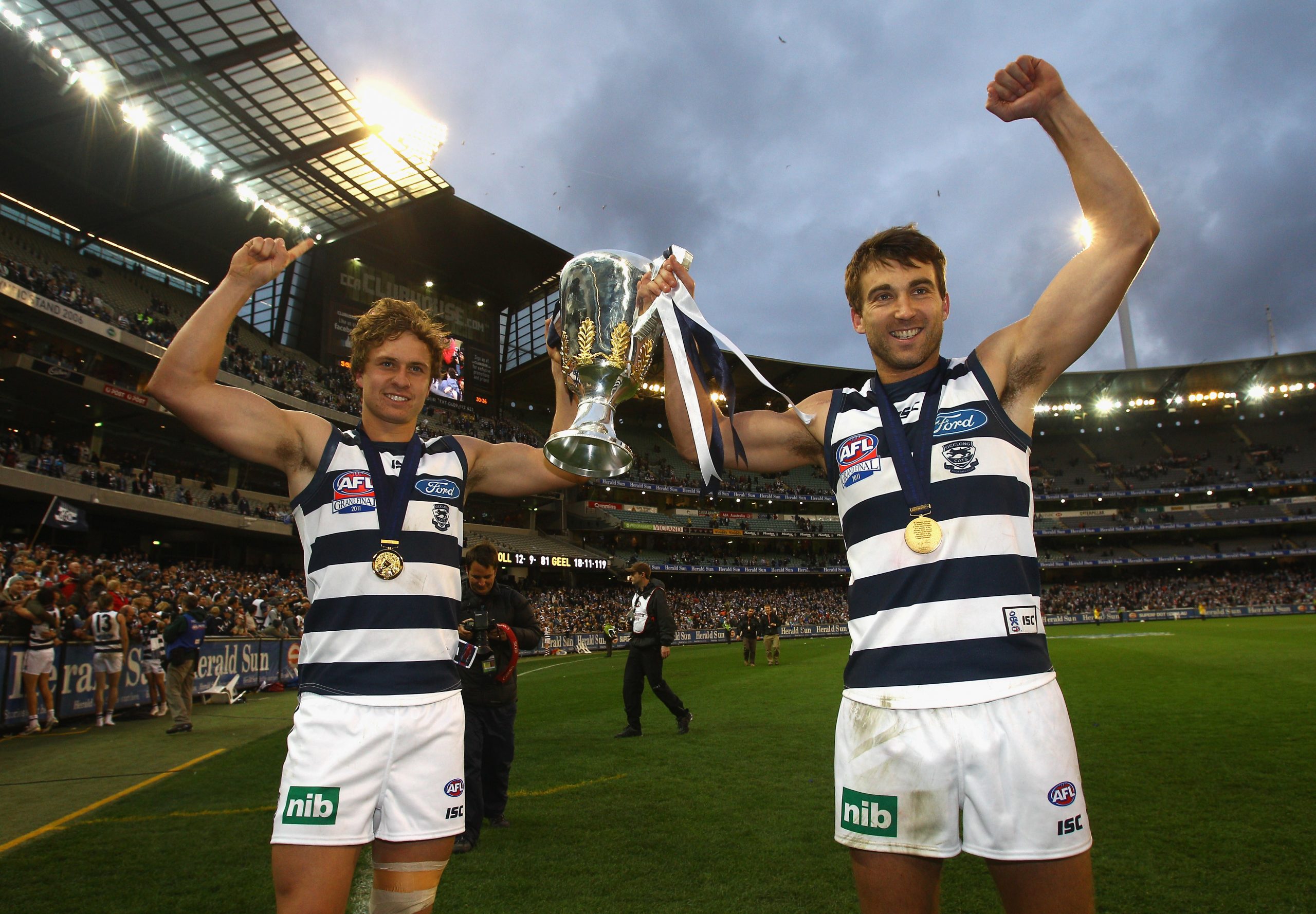 Corey Enright (R) with Mitch Duncan after the 2011 Grand Final.