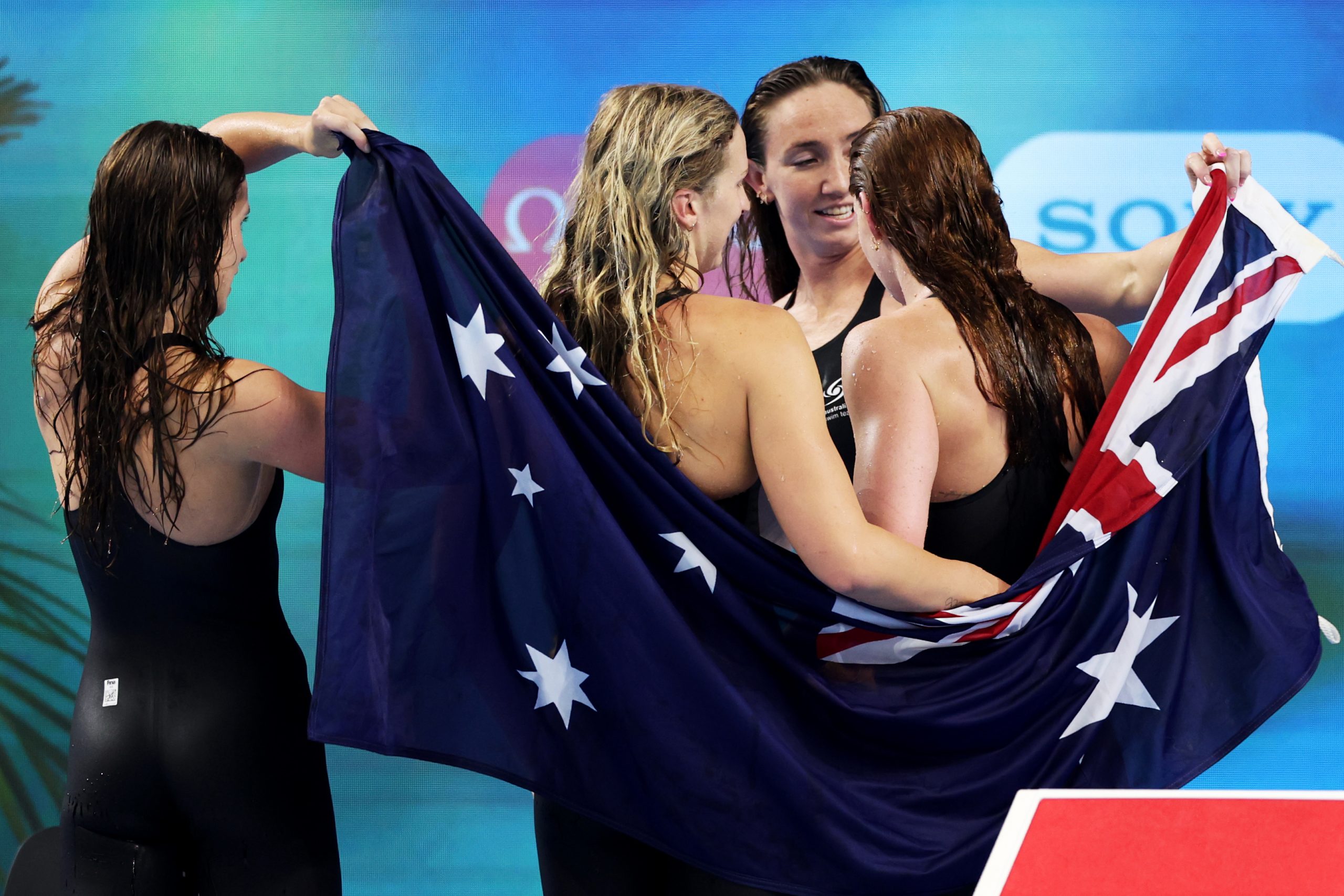 Australia's relay golden girls celebrate their triumph.