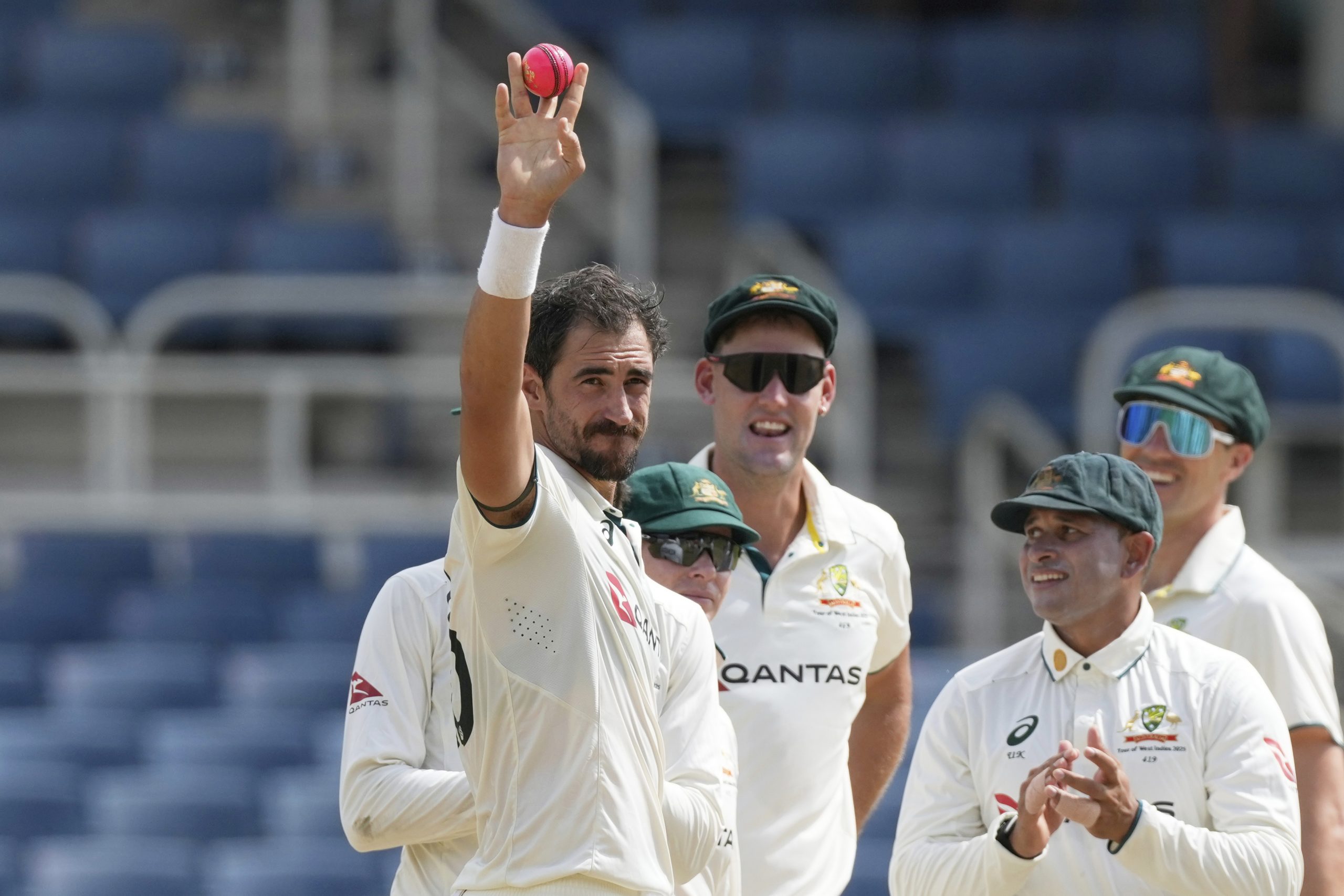 Mitchell Starc celebrates his 400th Test wicket.