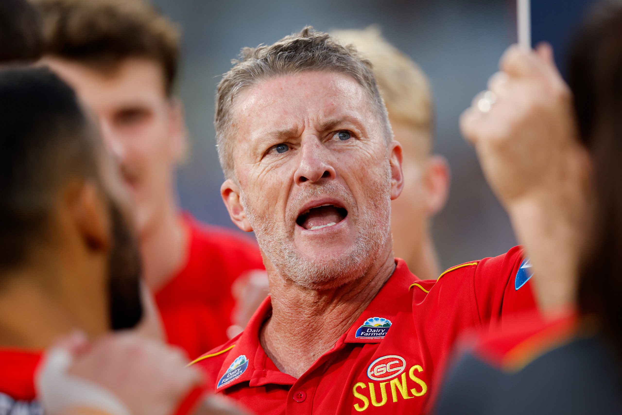 Damien Hardwick, Senior Coach of the Suns addresses his players during the 2024 AFL Round 24 match between the Richmond Tigers and the Gold Coast SUNS at The Melbourne Cricket Ground on August 24, 2024 in Melbourne, Australia. (Photo by Dylan Burns/AFL Photos via Getty Images)