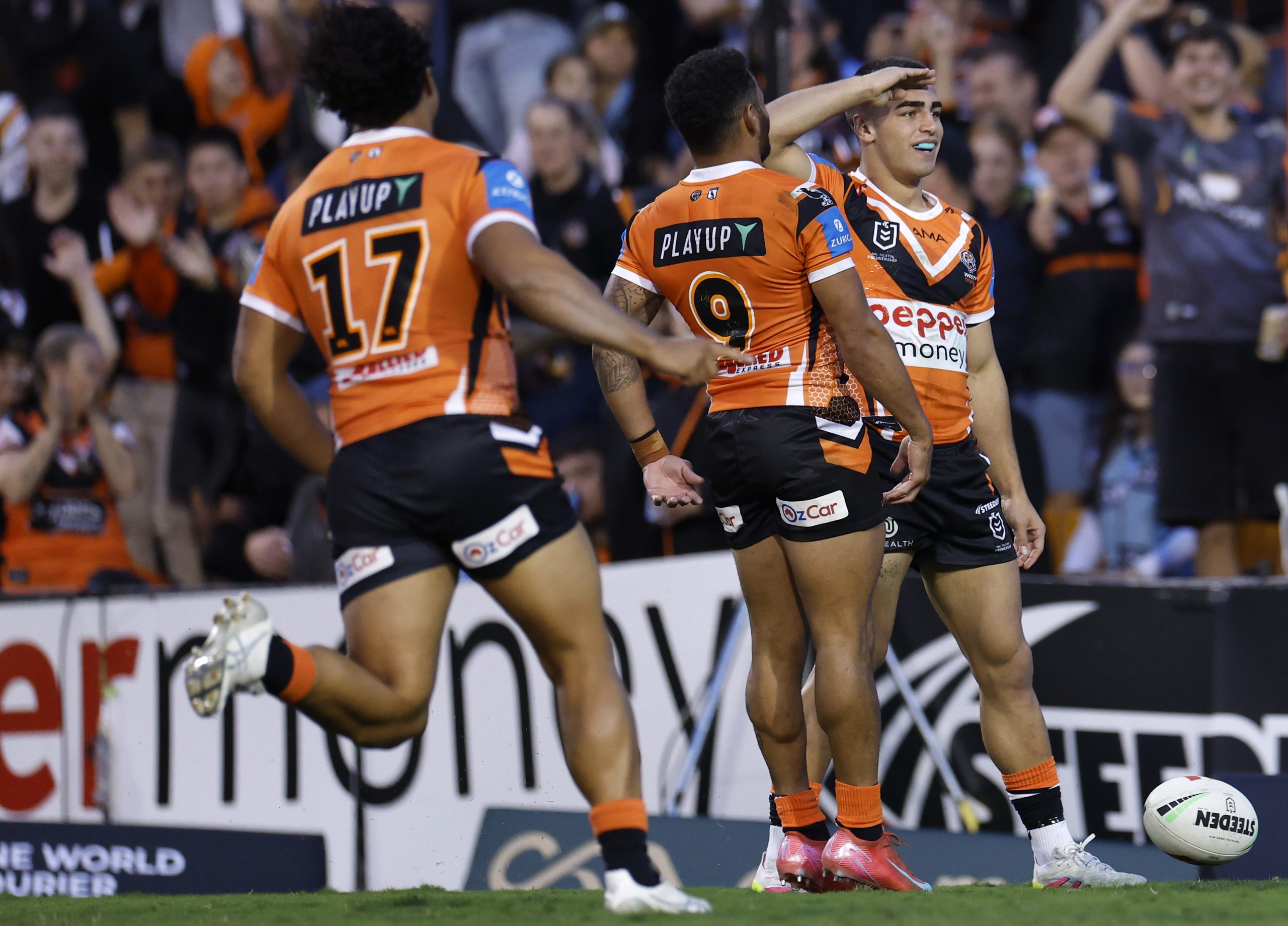 Tallyn Da Silva celebrates scoring a try for Wests Tigers.