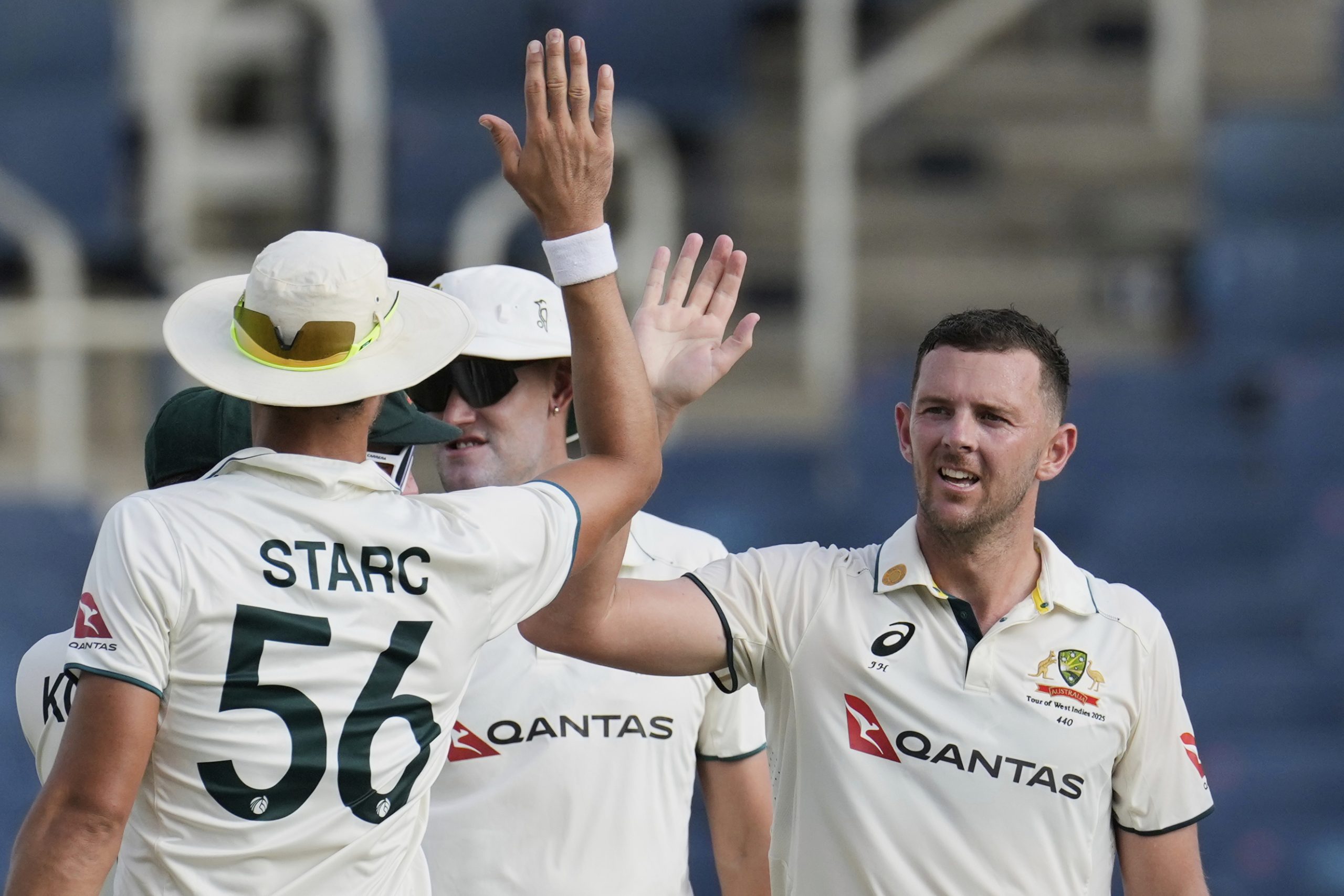 Josh Hazlewood and Mitchell Starc high-five each other during the third Test.