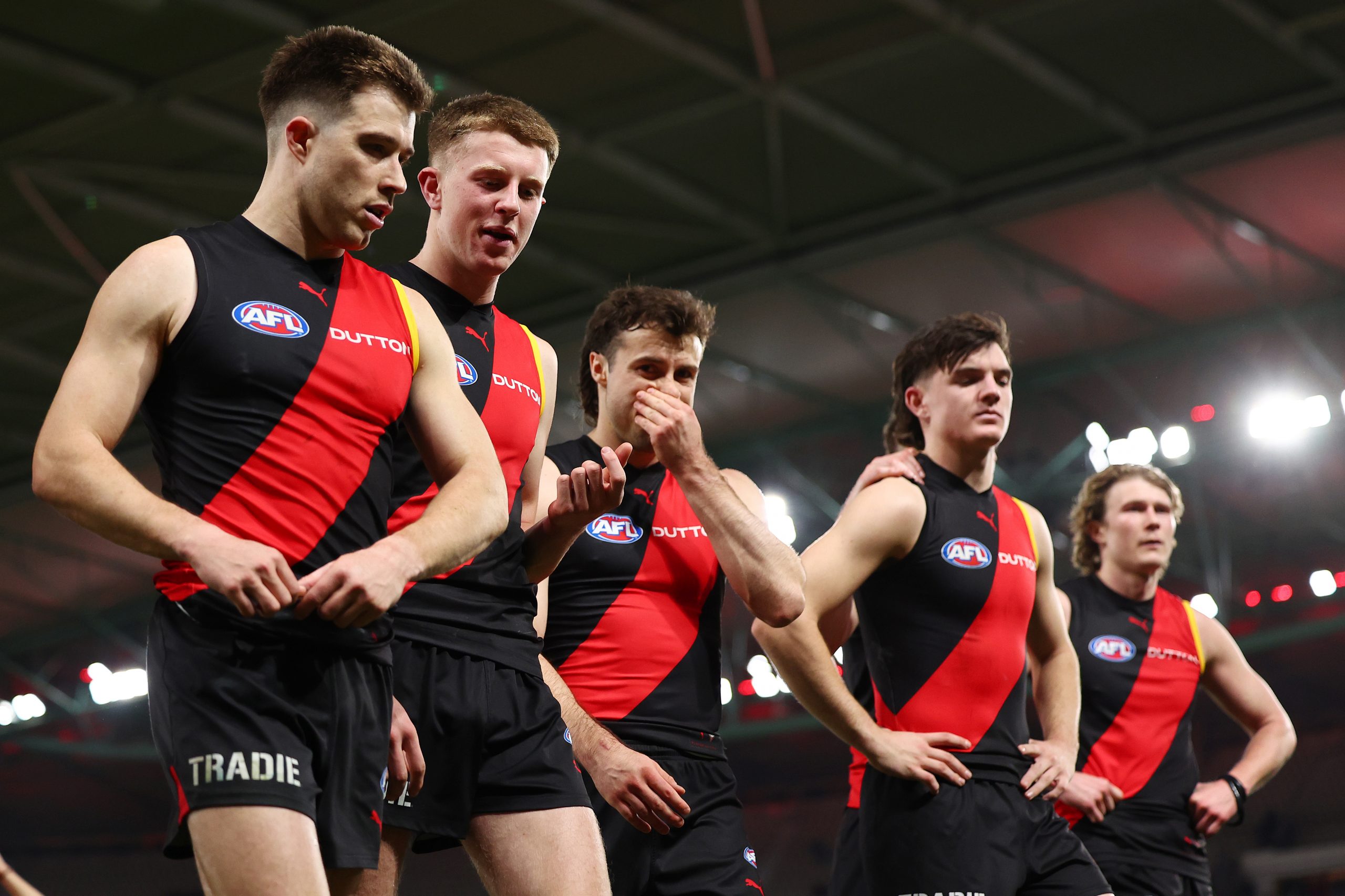 The Bombers make their way off the ground following their loss to the Giants.