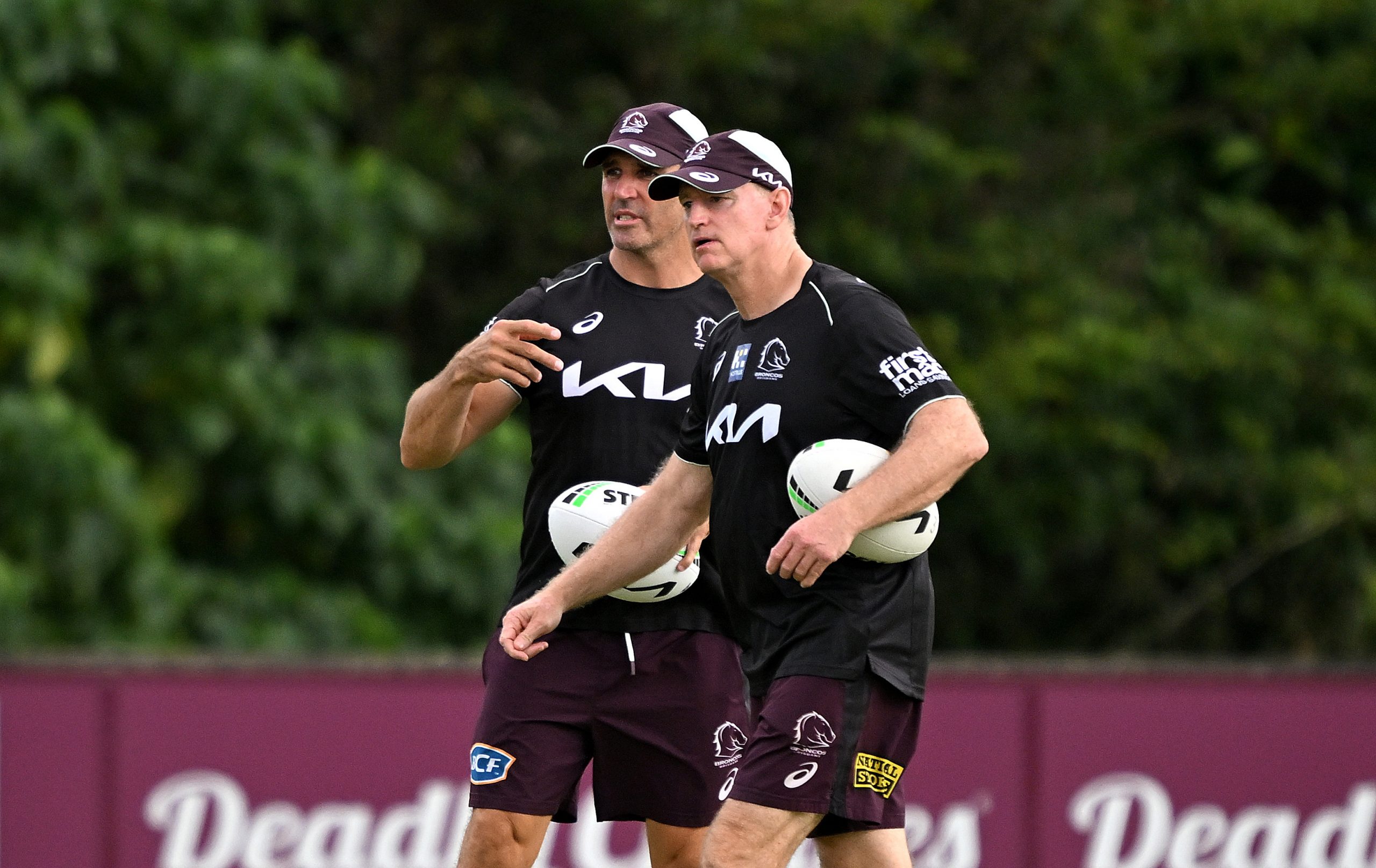 Broncos coach Michael Maguire and assistant Trent Barrett.