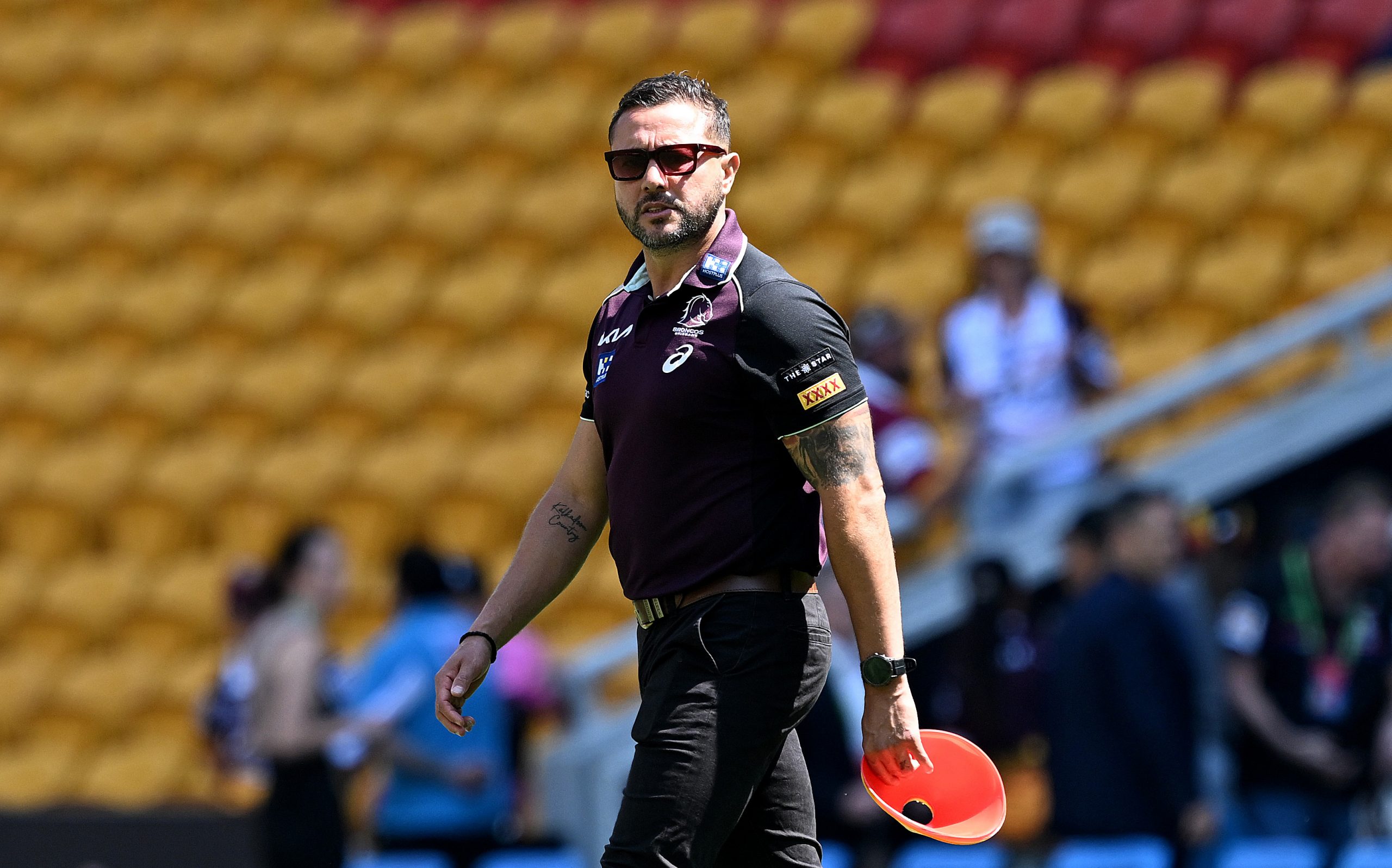 Broncos NRLW coach Scott Prince watches on during the warm up before the preliminary final against the Newcastle Knights.