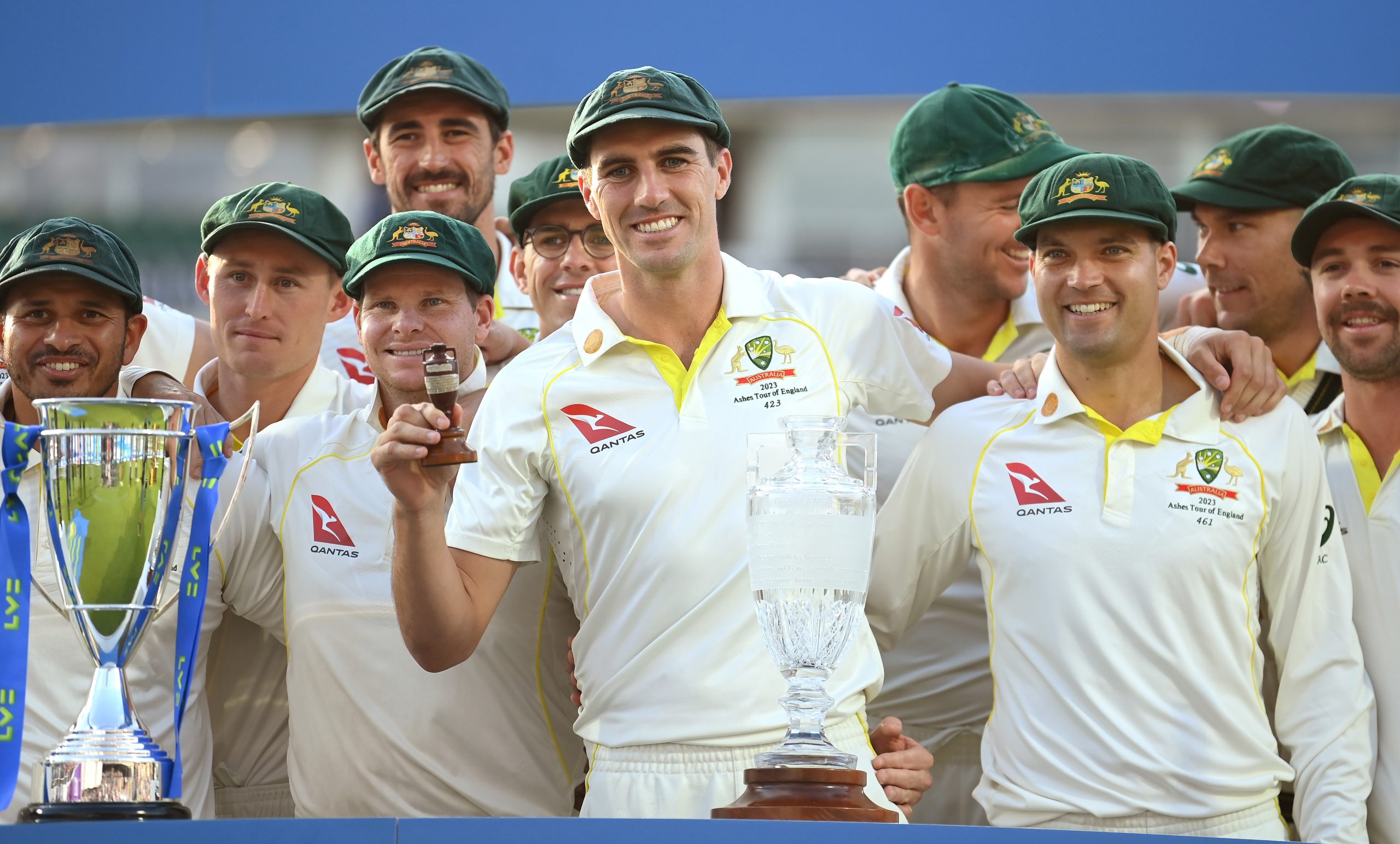 Australian captain Pat Cummins celebrates by lifting the Ashes Urn after successfully retaining the series in 2023.