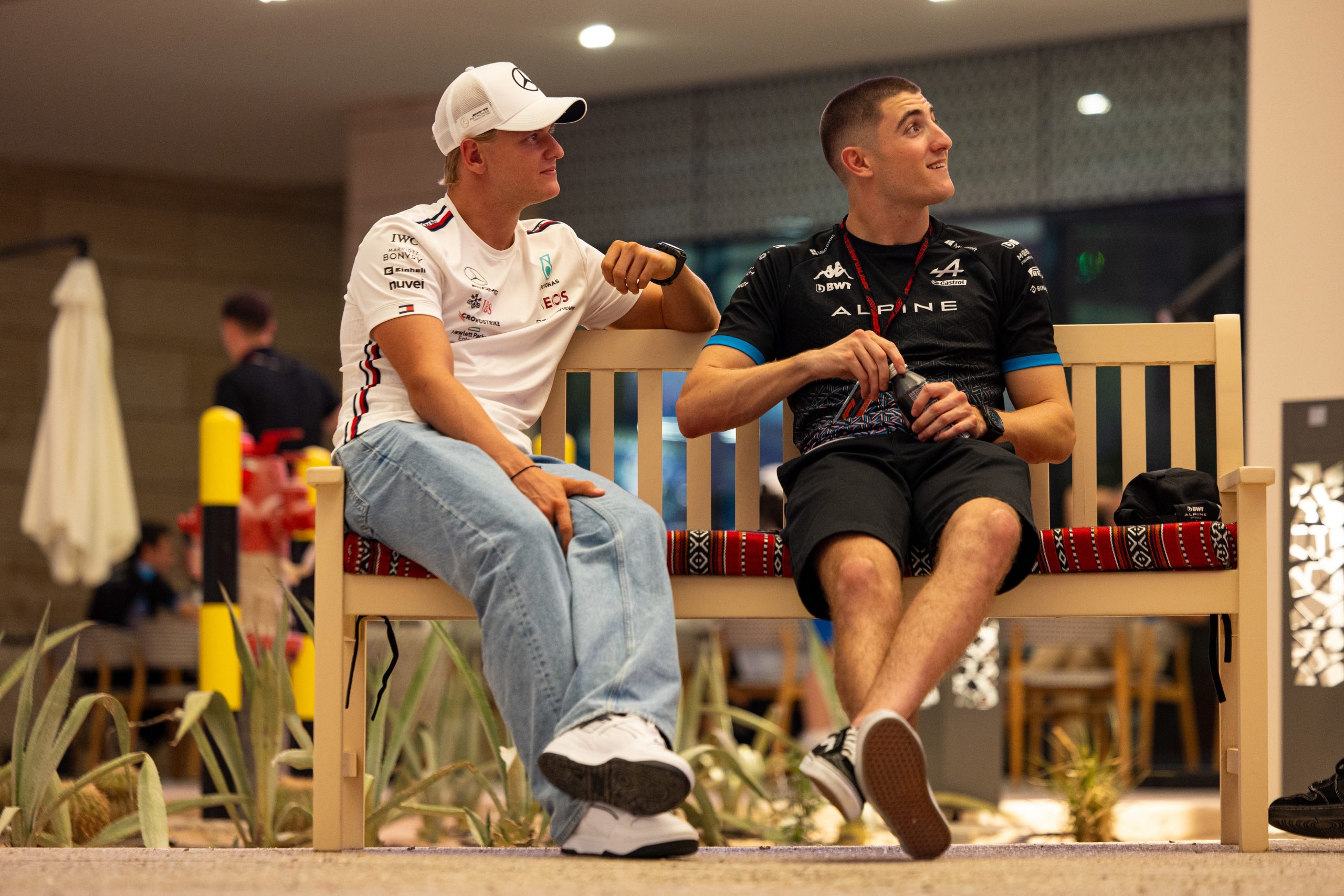 Mick Schumacher and Jack Doohan chat in the paddock.