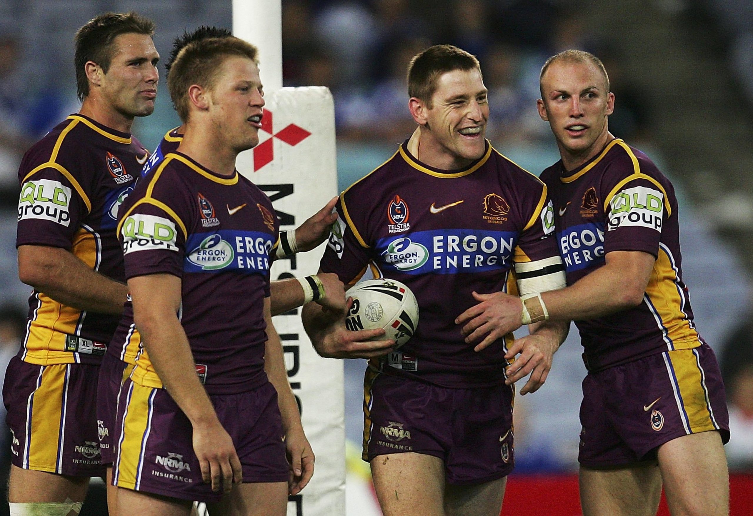 SYDNEY, AUSTRALIA - AUGUST 18:  Brent Tate of the Broncos celebrates scoring a try with team mates during the round 24 NRL match between the Bulldogs and the Brisbane Broncos at Telstra Stadium August 18, 2006 in Sydney, Australia.  (Photo by Cameron Spencer/Getty Images)