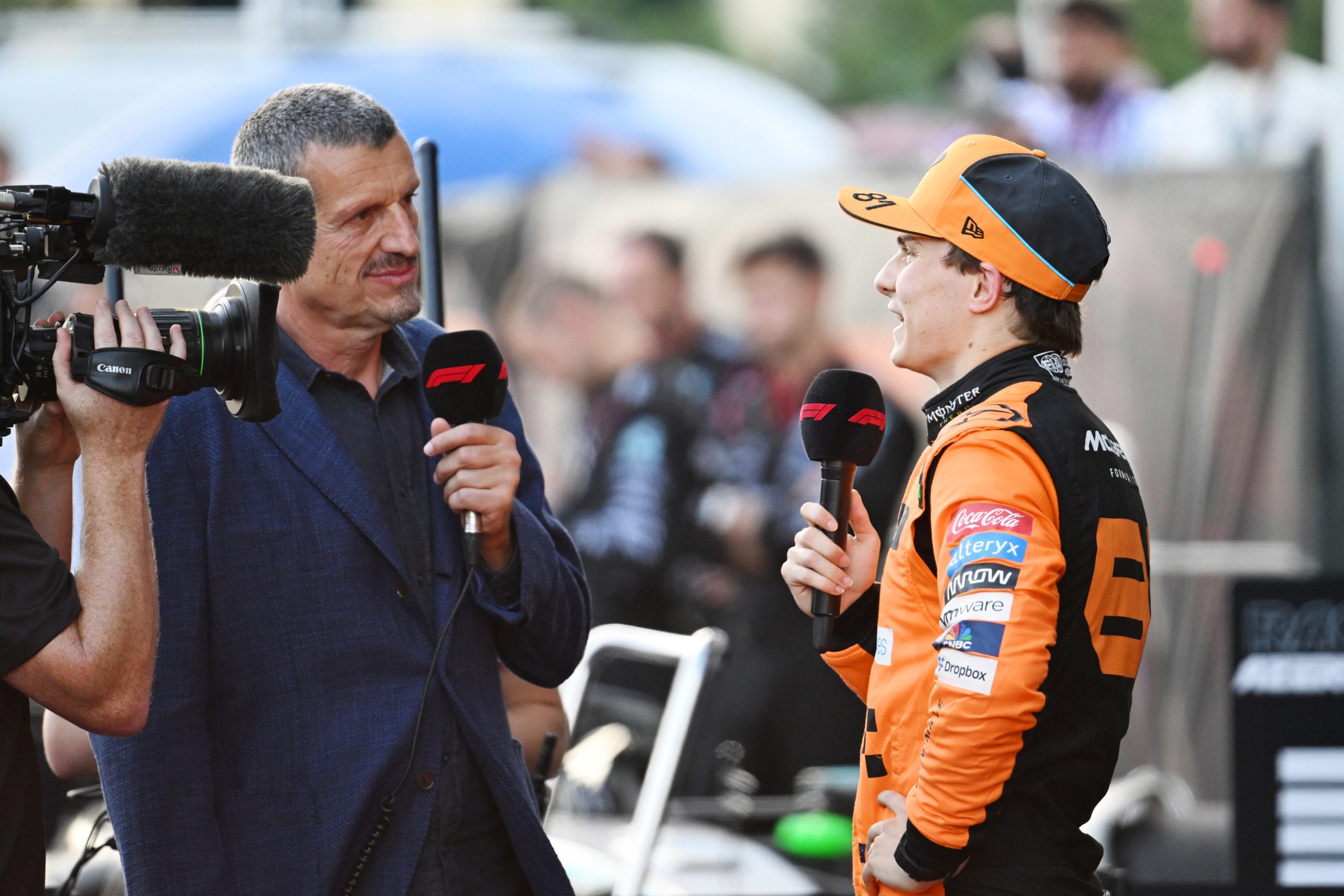 Oscar Piastri is interviewed by Guenther Steiner in Parc Ferme during the F1 Grand Prix.