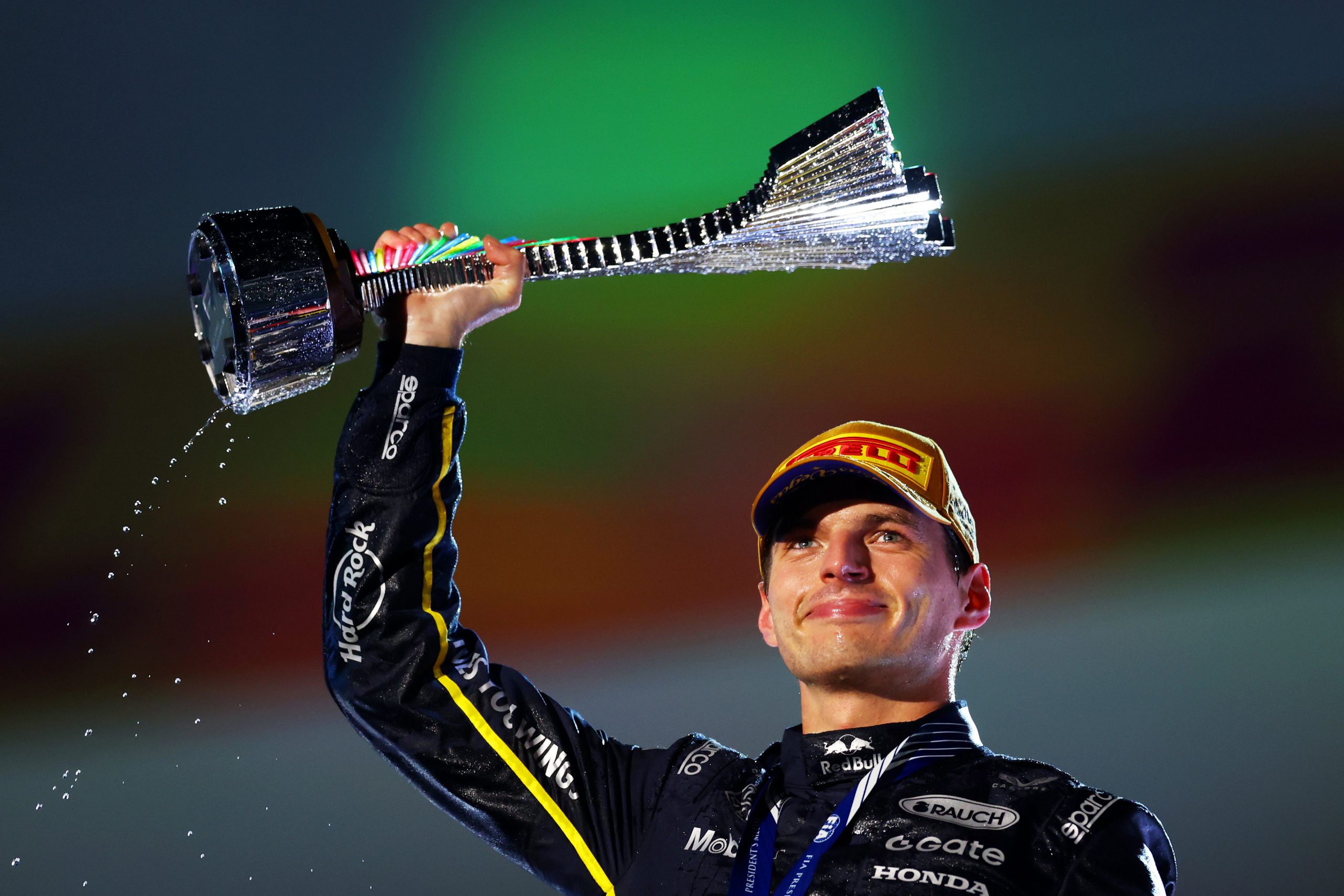 LAS VEGAS, NEVADA - NOVEMBER 22: Race winner Max Verstappen of the Netherlands and Oracle Red Bull Racing lifts his trophy on the podium during the F1 Grand Prix of Las Vegas at Las Vegas Strip Circuit on November 22, 2025 in Las Vegas, Nevada. (Photo by Clive Rose/Getty Images)
