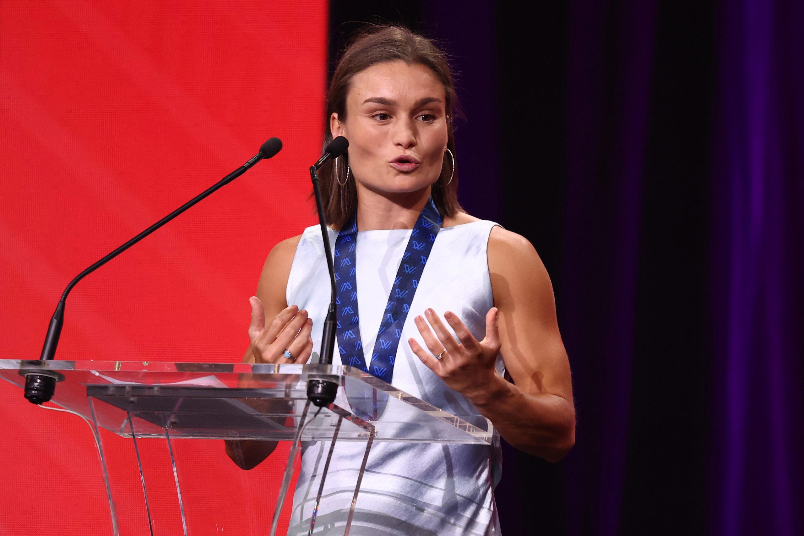 Ash Riddell of the Kangaroos addresses the room after winning the 2025 AFLW best and fairest award.