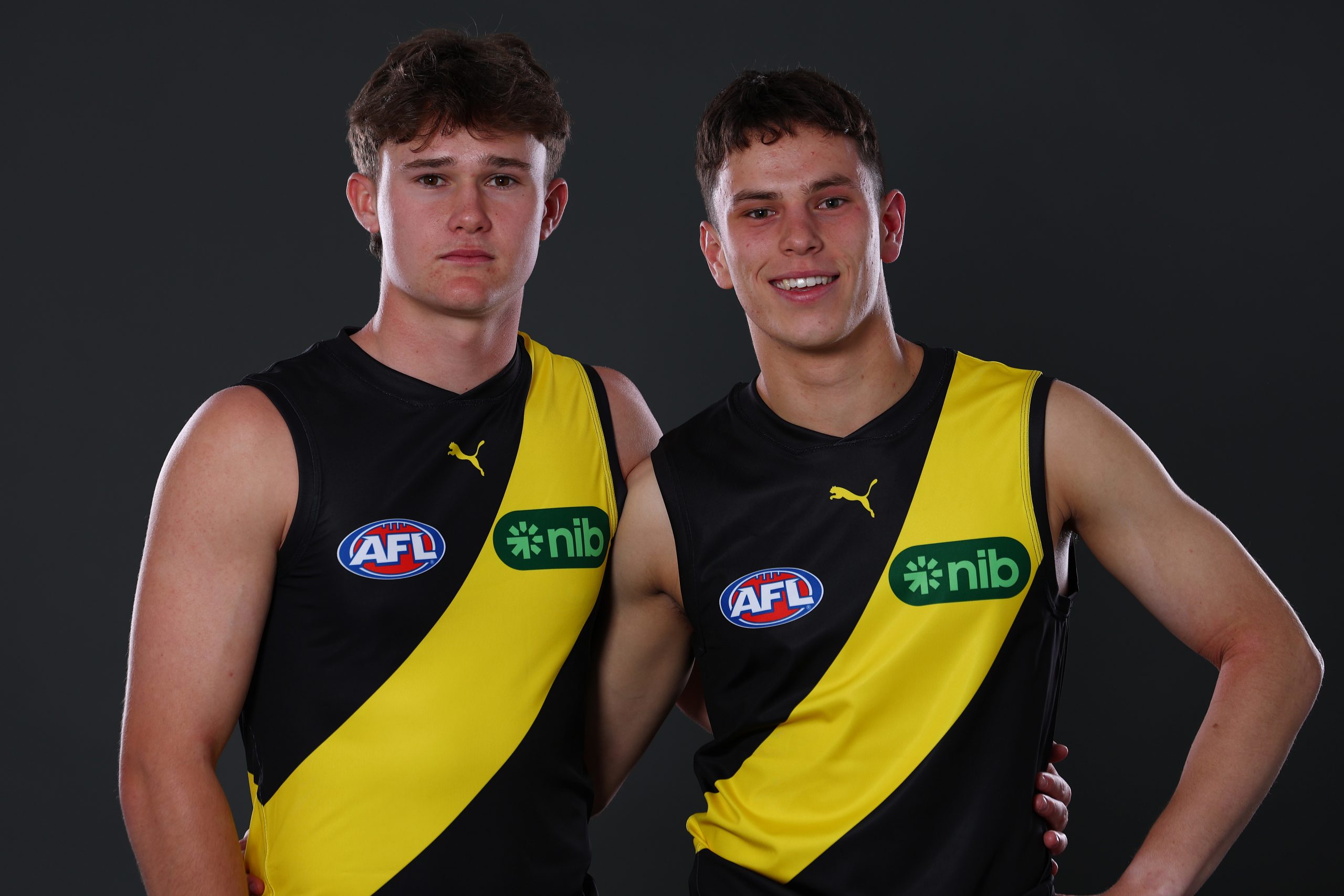 Sam Cumming and Samuel Grlj pose after being selected by the Tigers as part of the 2025 AFL Draft.