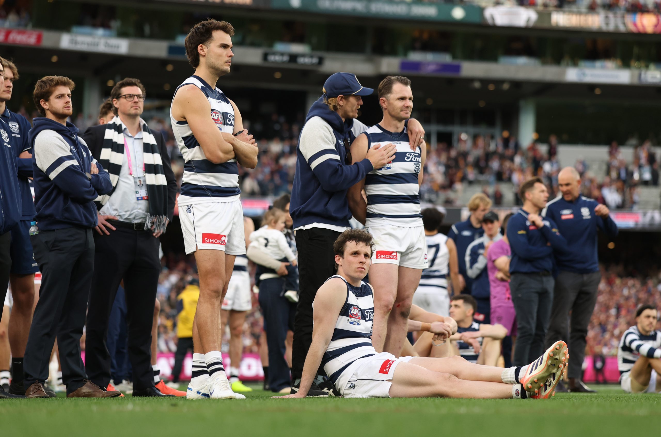 The Cats look on after they were defeated by the Lions 