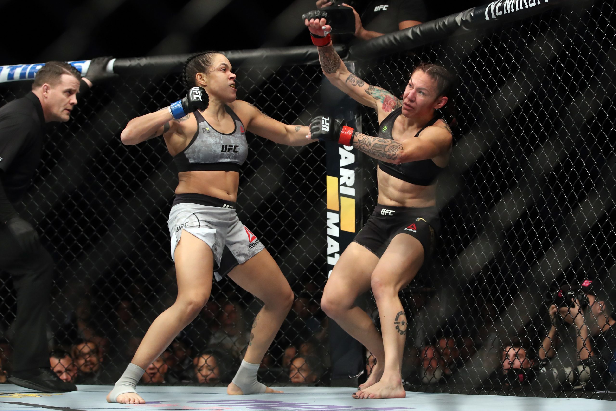 Amanda Nunes of Brazil punches Cris Cyborg of Brazil.