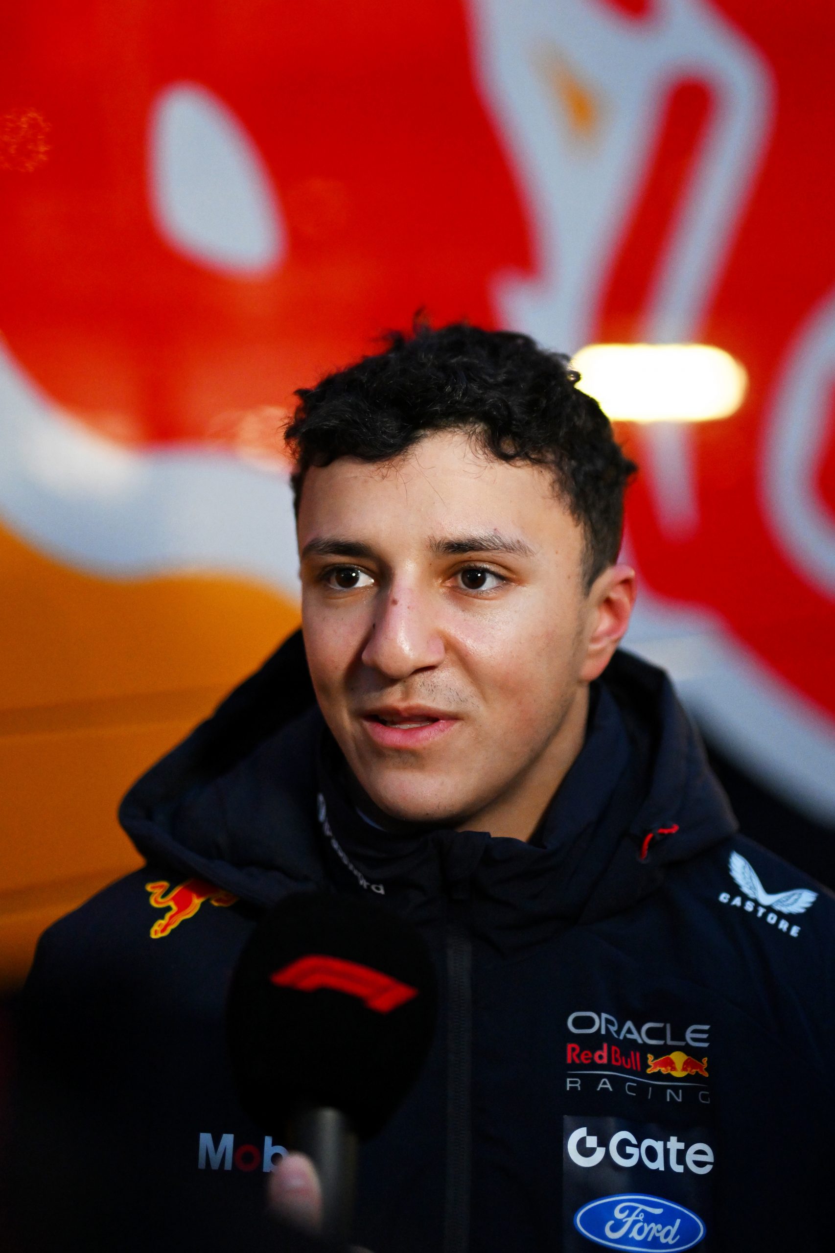 Isack Hadjar of France and Oracle Red Bull Racing is interviewed during day one of F1 Shakedown at Circuit de Catalunya on January 26, 2026 in Montmelo, Spain. (Photo by Rudy Carezzevoli/Getty Images)