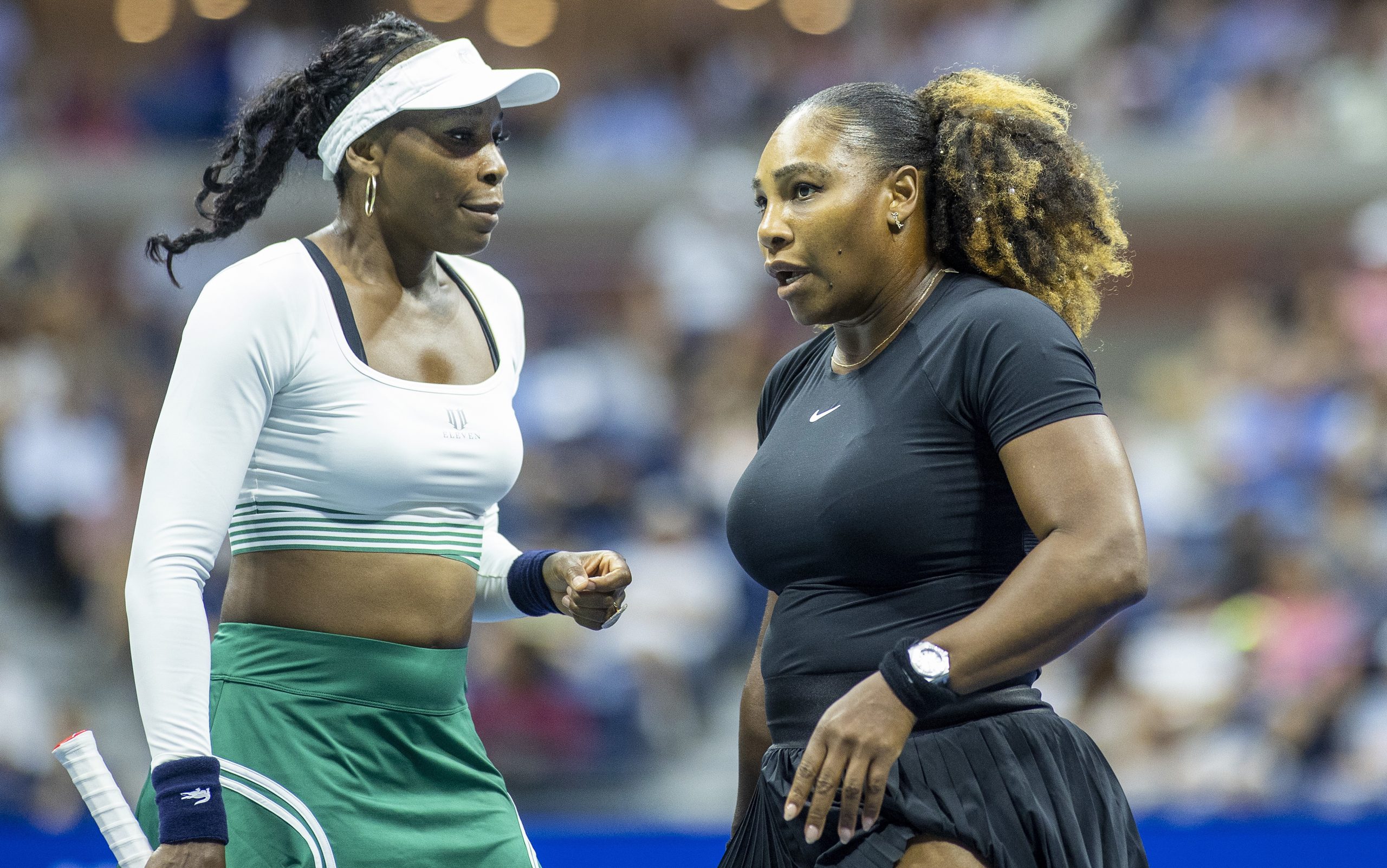 Venus Williams (left) and her sister Serena playing as a doubles pair at the 2022 US Open.