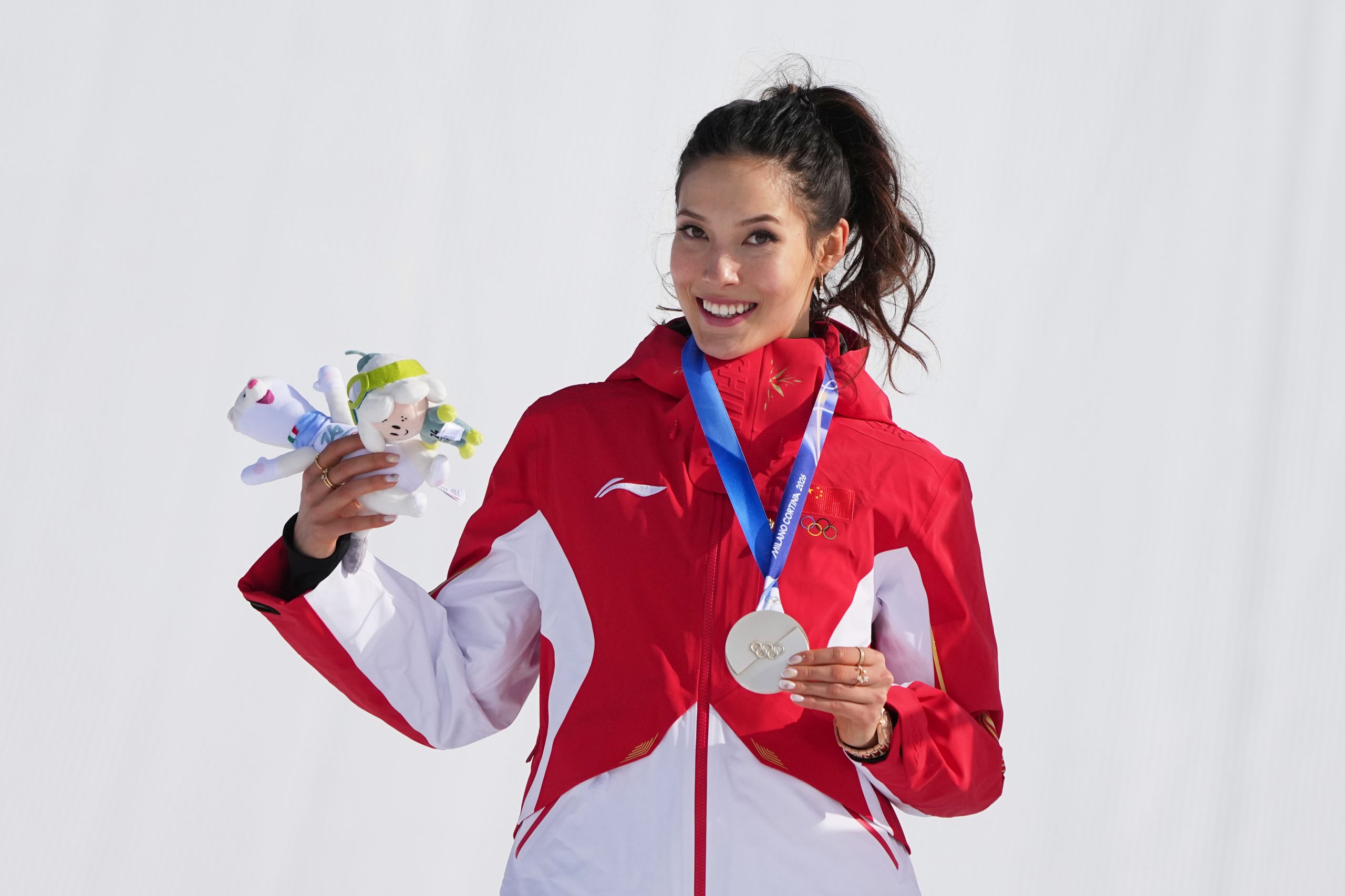 Eileen Gu celebrates with her silver medal after the women's freestyle skiing slopestyle final in Livigno.