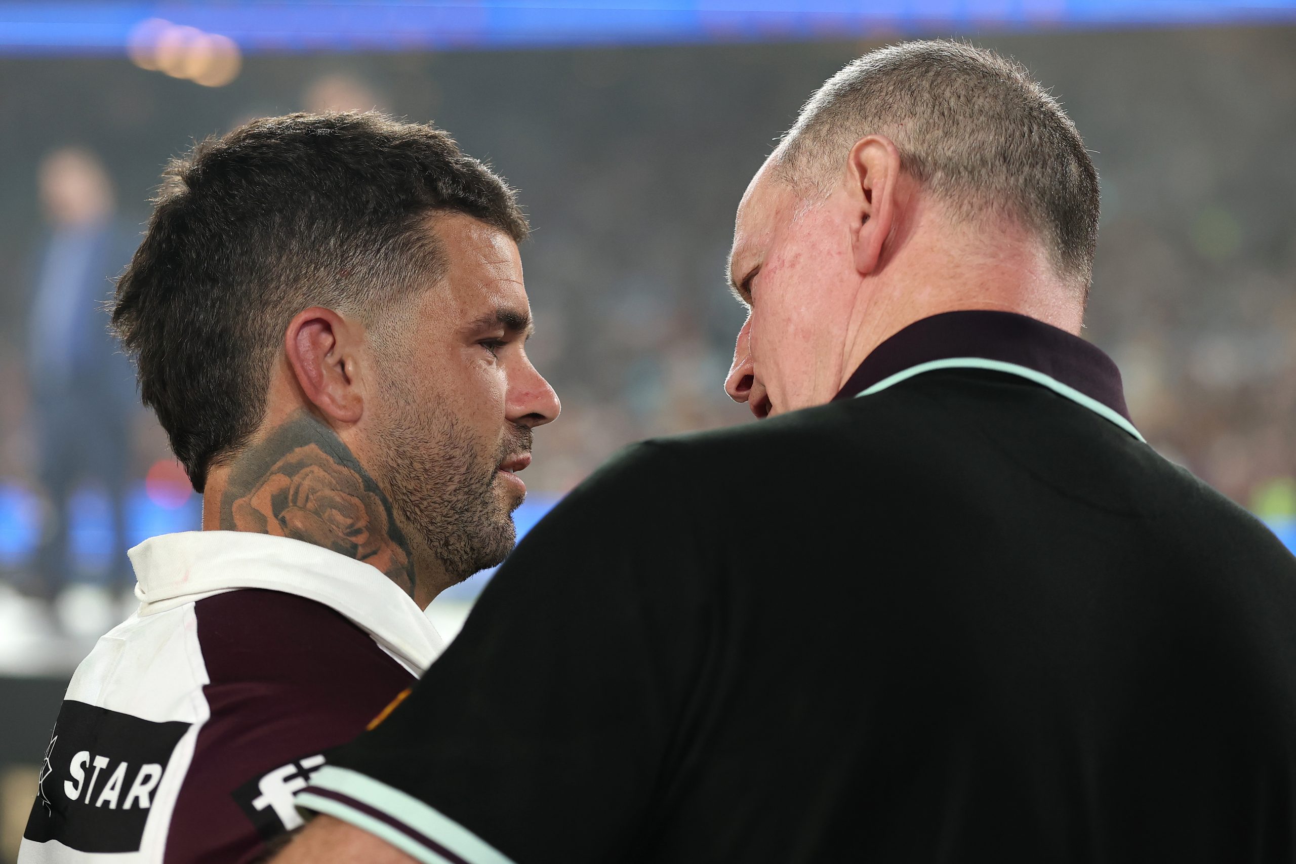 SYDNEY, AUSTRALIA - OCTOBER 05: Adam Reynolds of the Broncos speaks to Michael Maguire, head coach of the Broncos after winning the NRL Grand Final match between the Melbourne Storm at Brisbane Broncos at Accor Stadium on October 05, 2025, in Sydney, Australia. (Photo by Cameron Spencer/Getty Images)