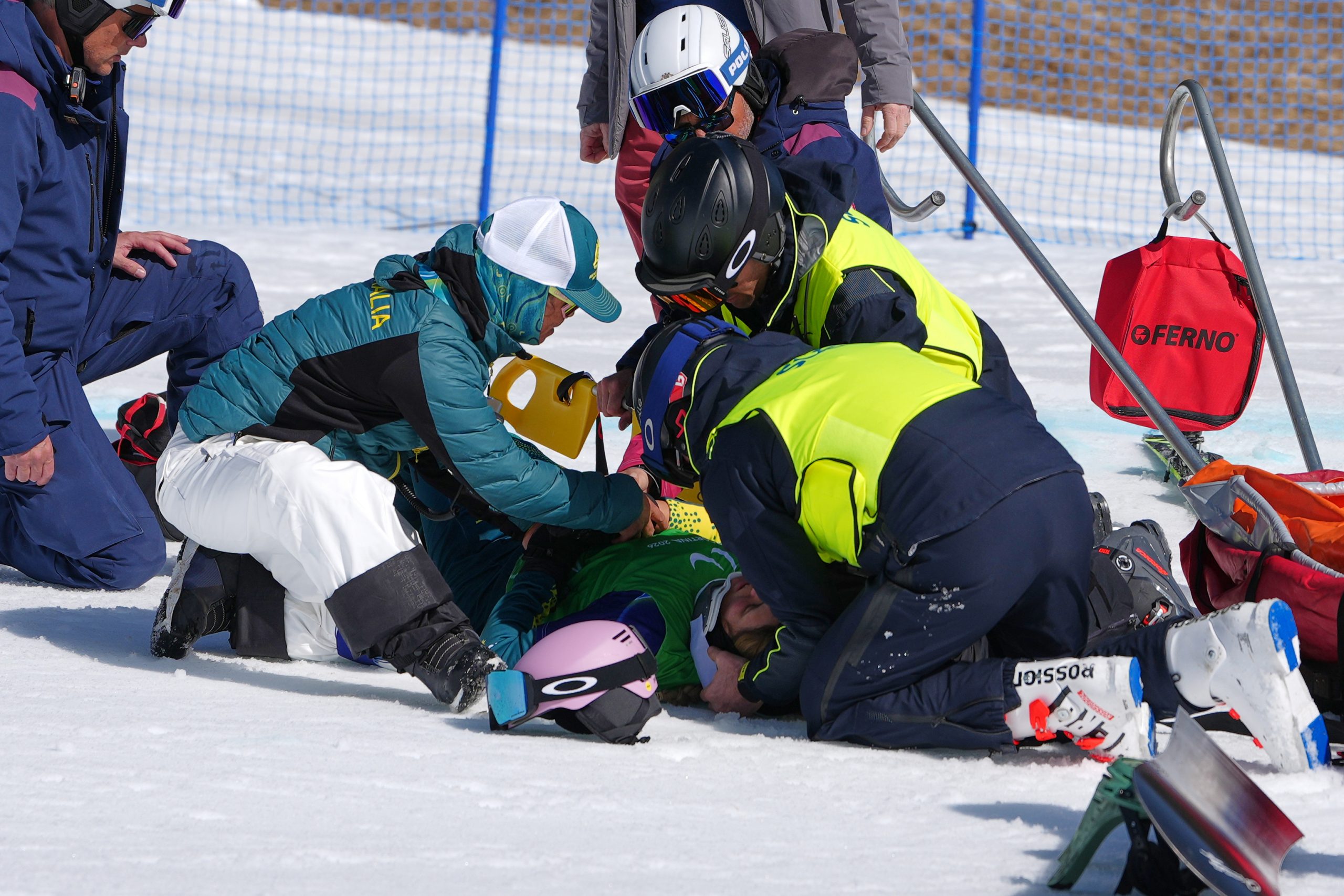 Amanda Reid of Australia is evacuated after crashing during a women's snowboard cross SB-LL2 pre-heat.