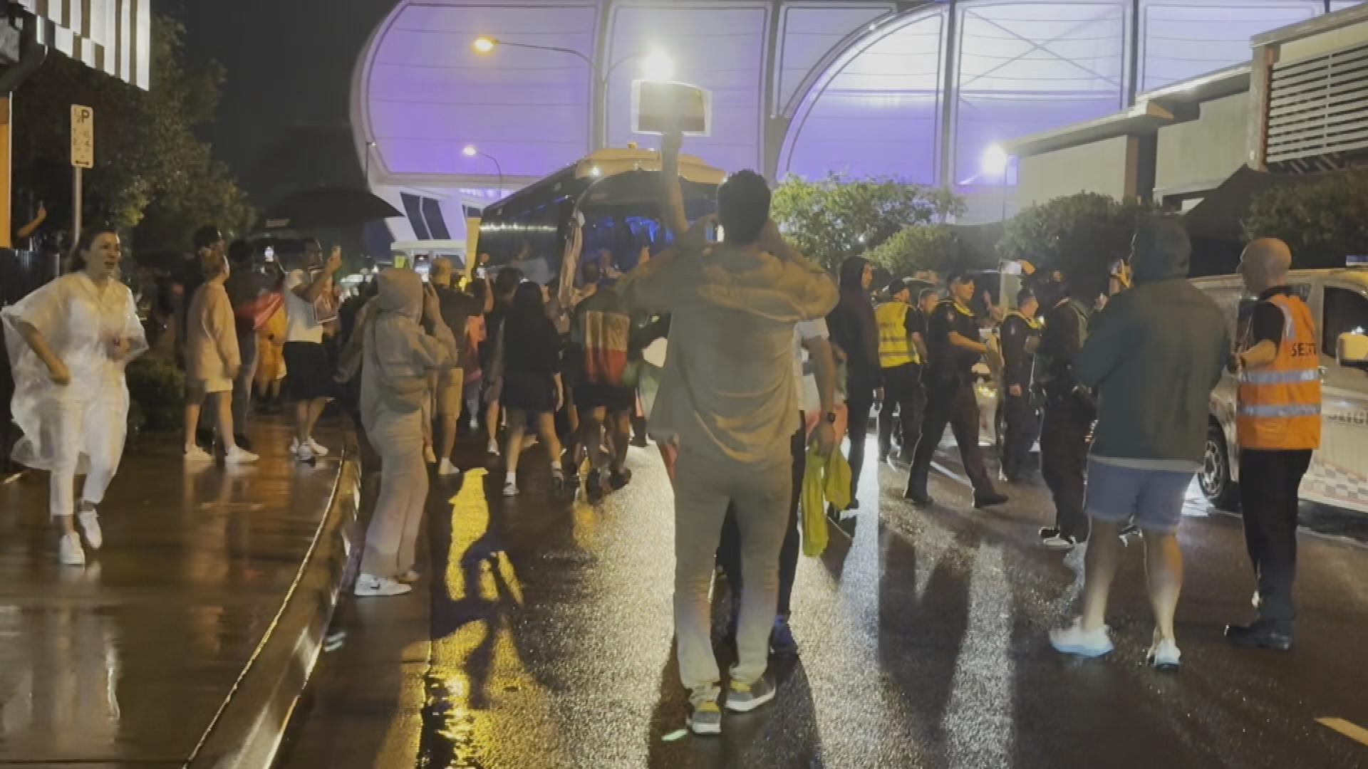 Protestors surround Iran team bus