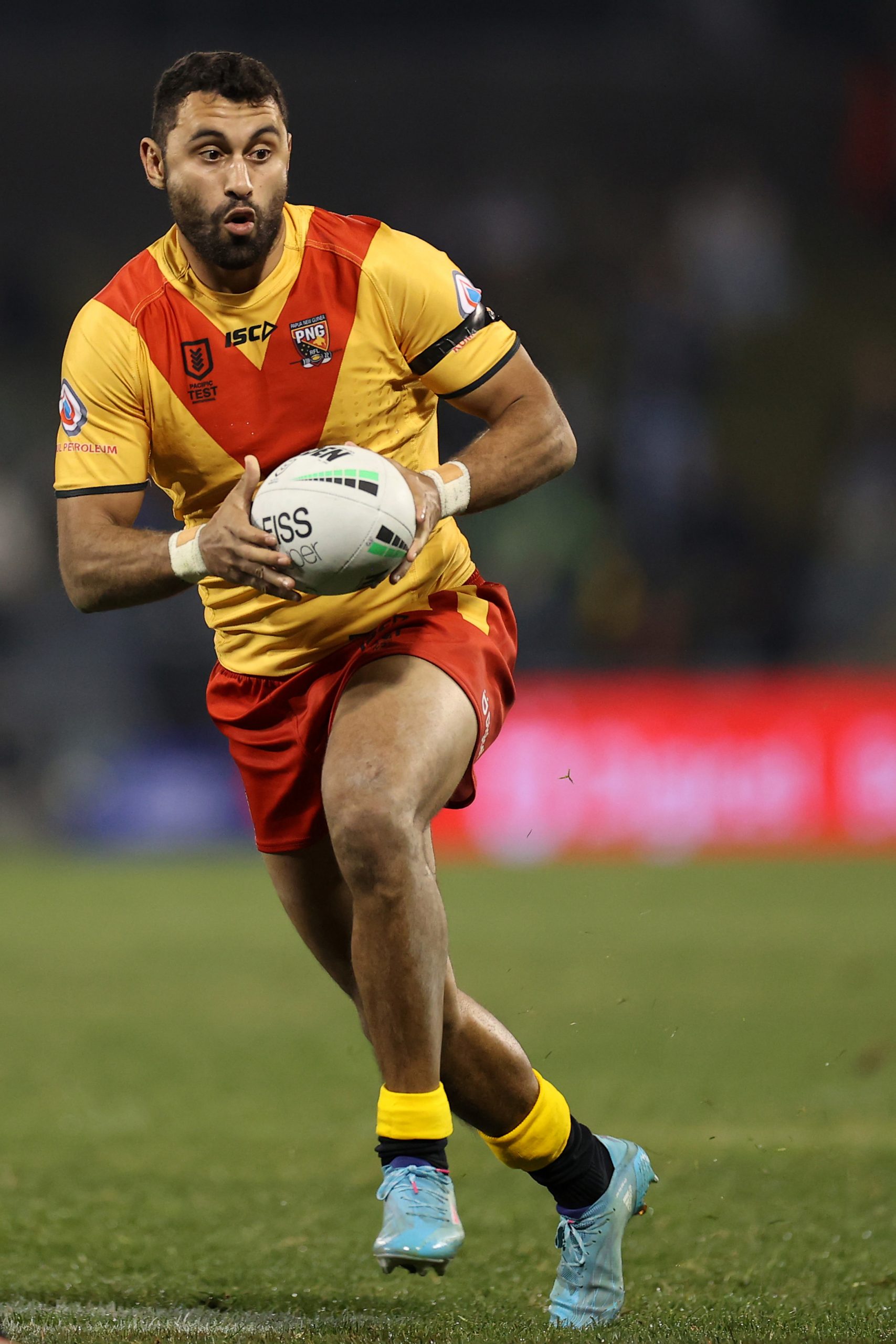 SYDNEY, AUSTRALIA - JUNE 25: Alex Johnston of Papua New Guinea runs the ball during the Men's International Test Match between Papua New Guinea and Fiji at Campbelltown Sports Stadium on June 25, 2022 in Sydney, Australia. (Photo by Mark Kolbe/Getty Images)