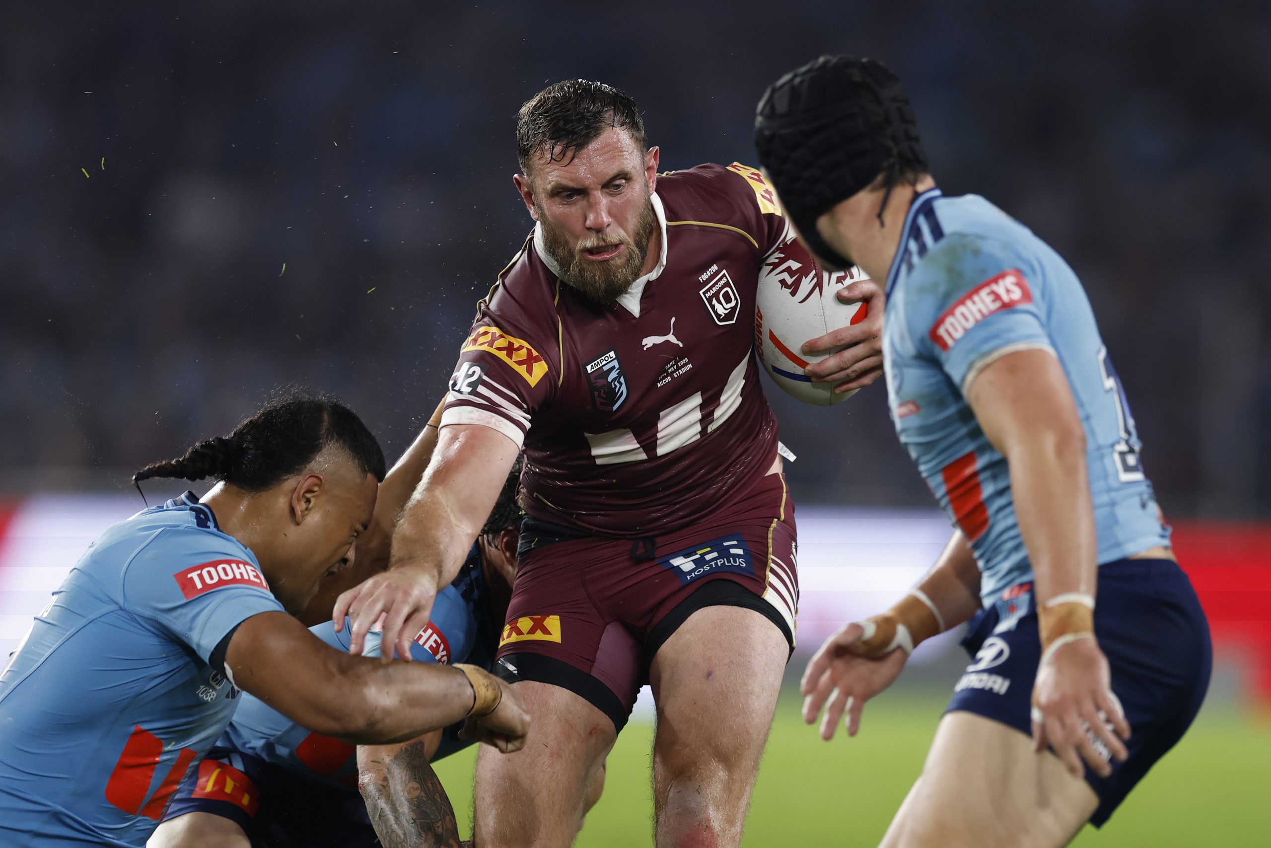 Kurt Capewell attempts to bust a tackle as he runs the ball in State of Origin I, 2026.