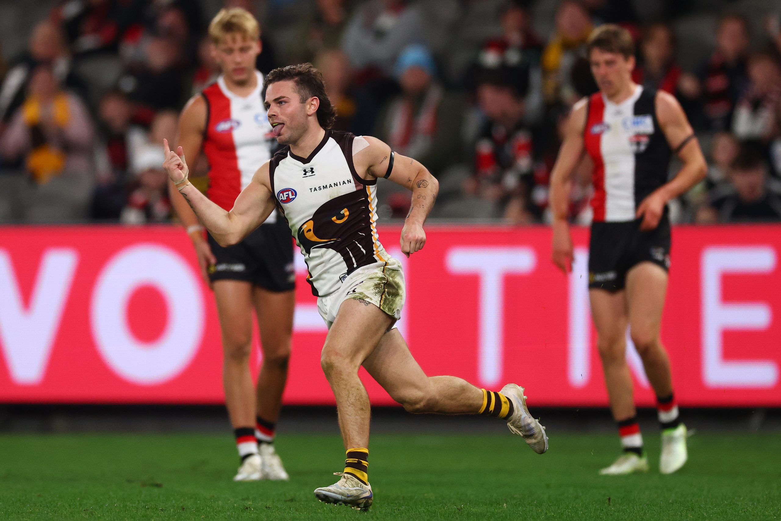 Nick Watson of the Hawks celebrates kicking a goal.