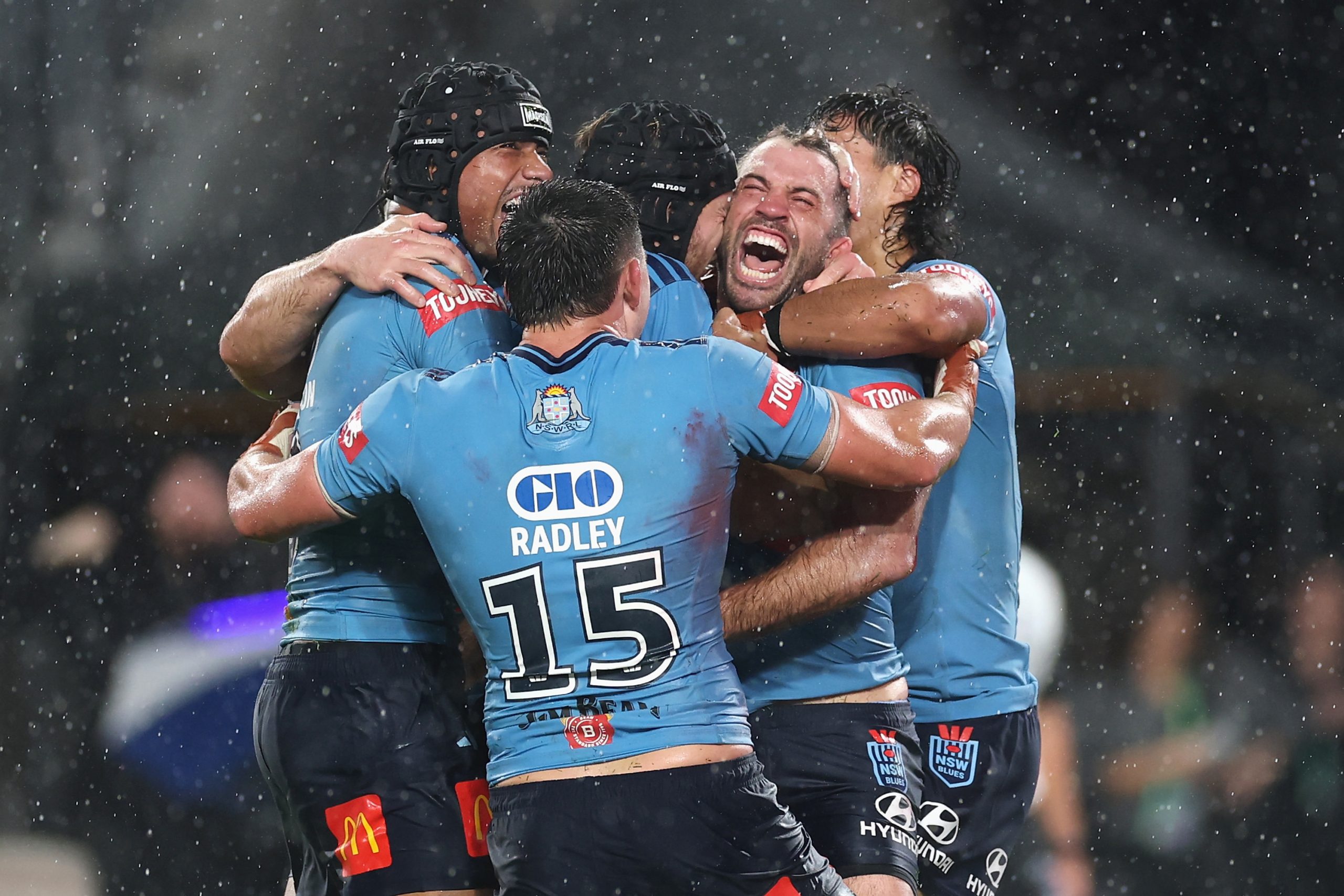 SYDNEY, AUSTRALIA - MAY 27: James Tedesco of the Blues celebrates scoring the match winning try with team mates during game one of the 2026 Men's State of Origin series between New South Wales Blues and Queensland Maroons at Accor Stadium on May 27, 2026 in Sydney, Australia. (Photo by Cameron Spencer/Getty Images)