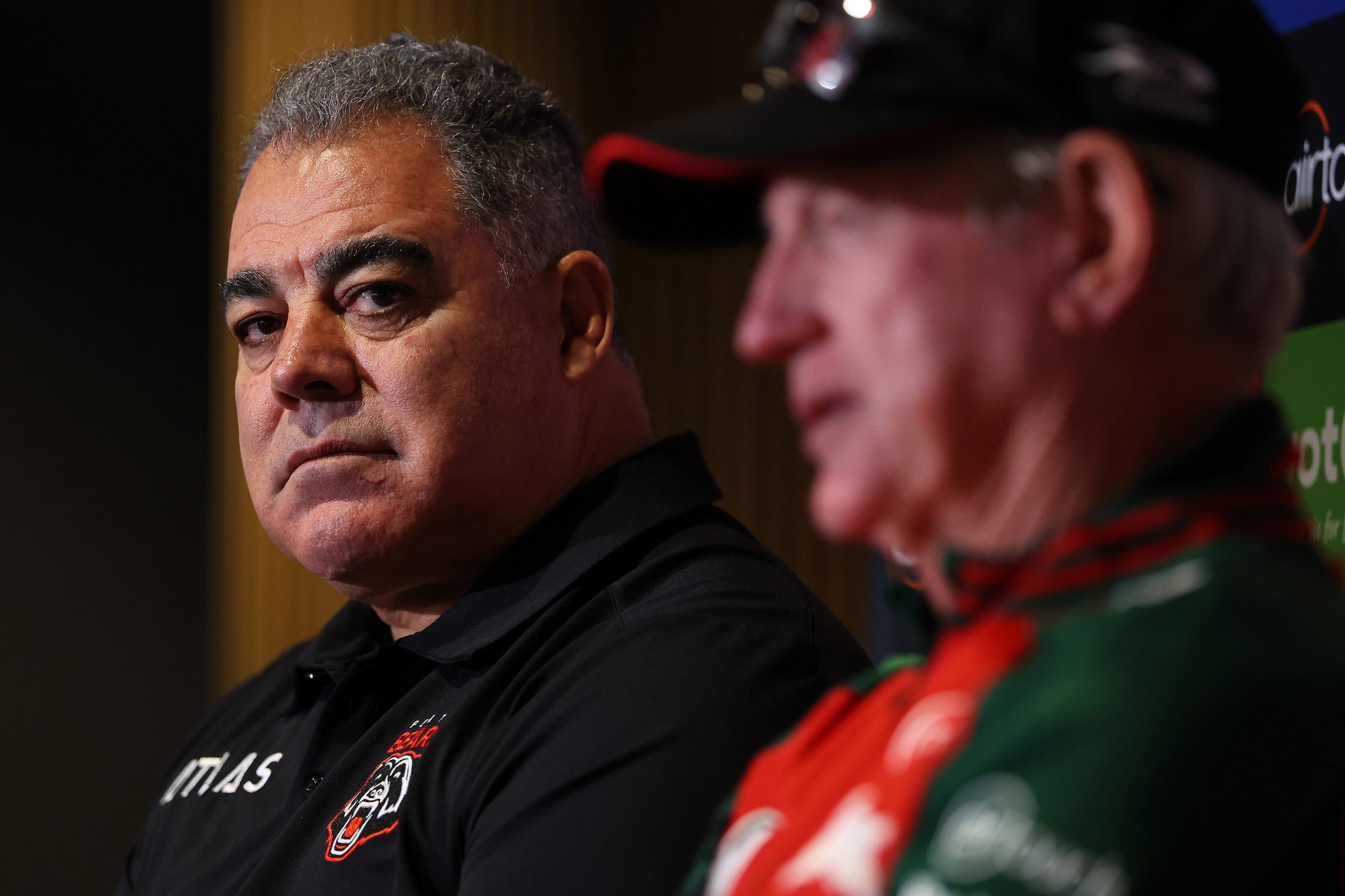 Perth Bears coach Mal Meninga sits beside South Sydney coach Wayne Bennett.