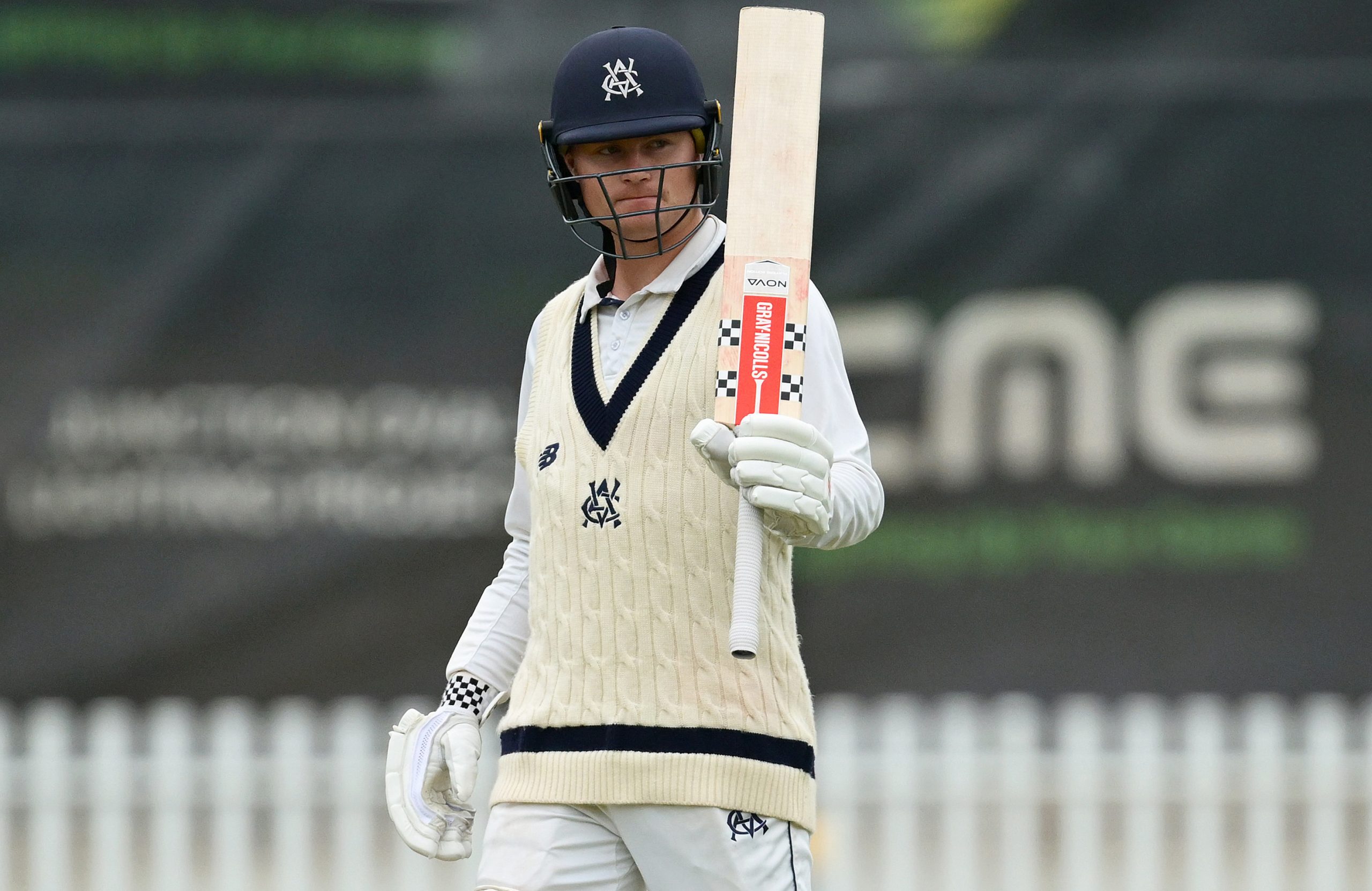 MELBOURNE, AUSTRALIA - MARCH 16: Oliver Peake of Victoria raises his bat after reaching 50 runs during day three of the Sheffield Shield  match between Victoria and South Australia at CitiPower Centre, on March 16, 2026, in Melbourne, Australia. (Photo by Quinn Rooney/Getty Images)