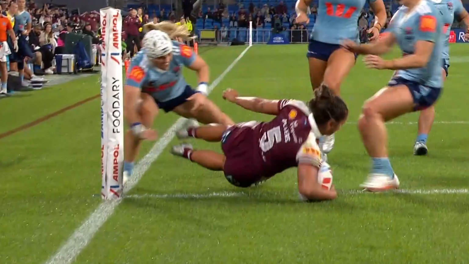 Peters dives over two Blues to score